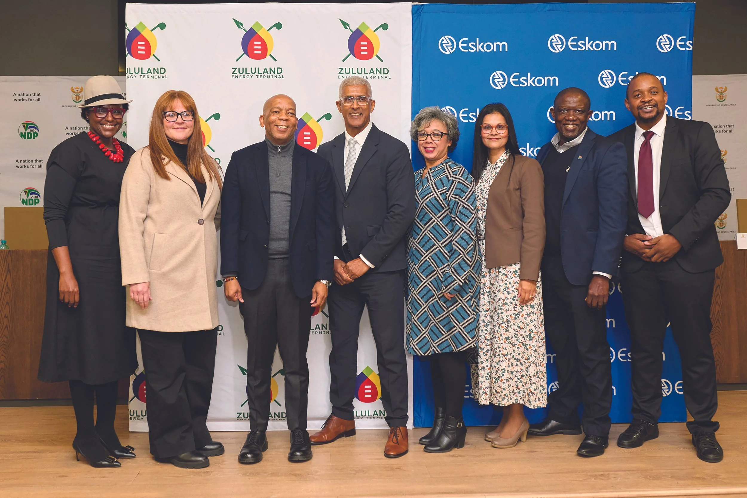 a group of professional people posing for a photo.