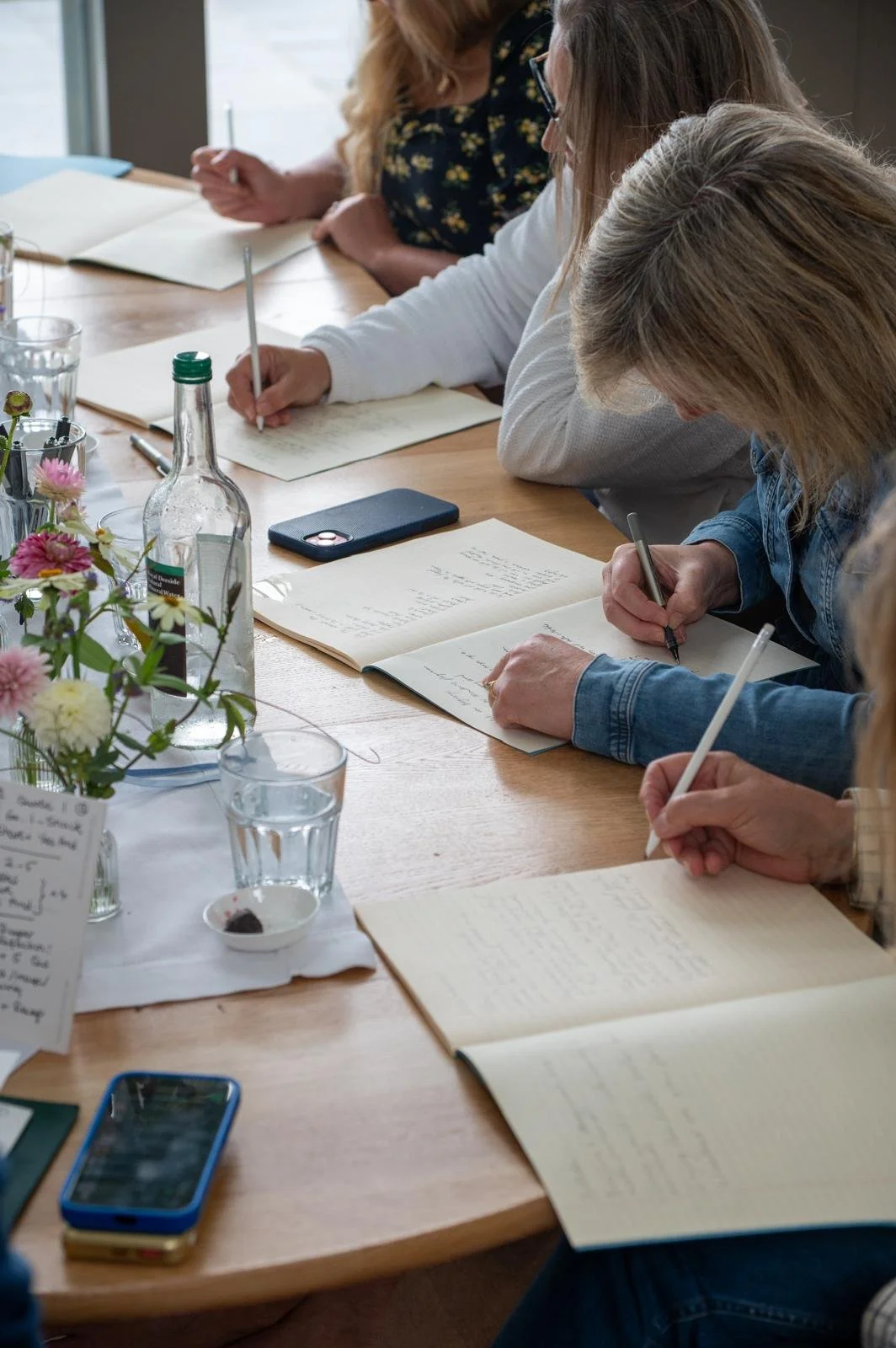 Journaling workshop participants writing in notebooks
