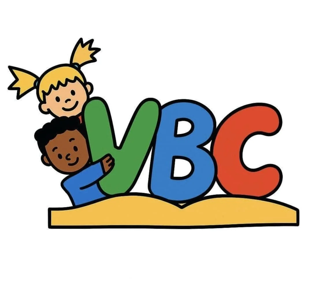 Children playing on colorful letters 'V', 'B', and 'C' on a book surface.