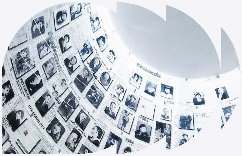 An exhibition of black-and-white photographs of people, hung on a wall.