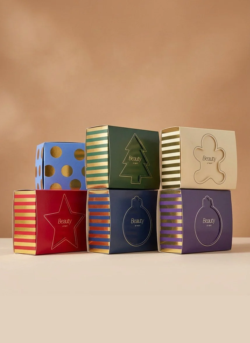 Stacked NEXT christmas stocking filler boxes