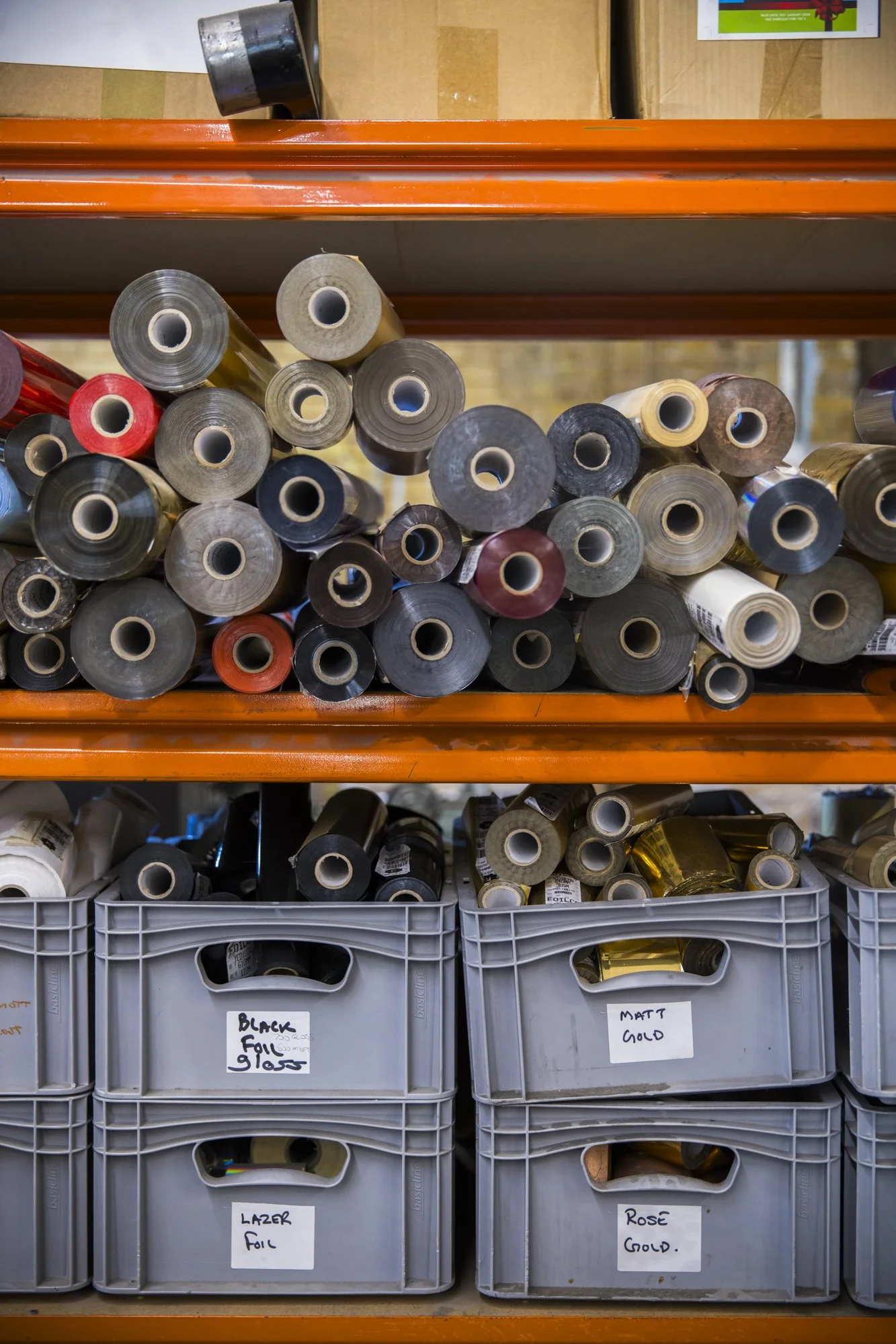 Rolls of foil paper on shelves