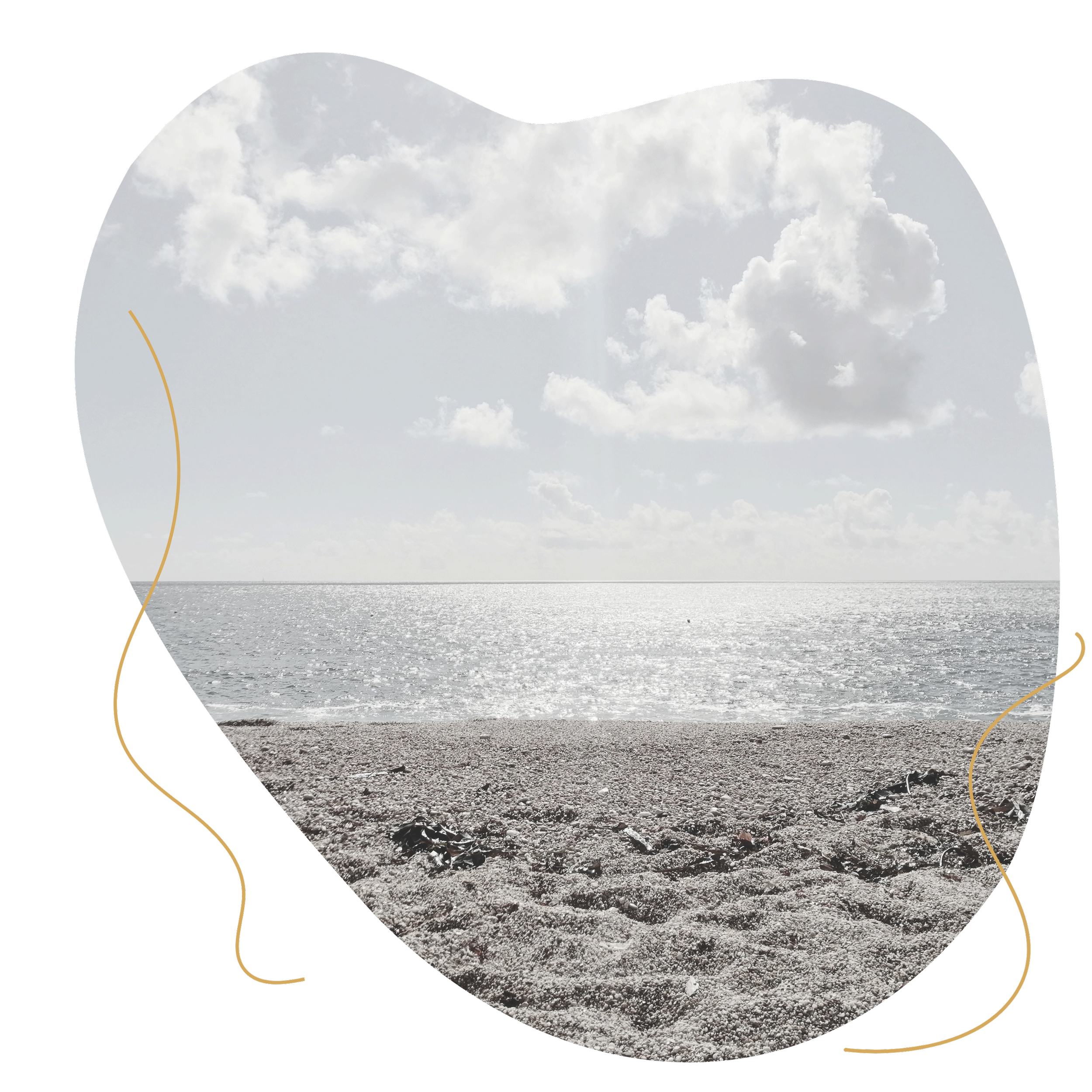 View of a sandy beach with gentle waves and a cloudy sky in the distance.