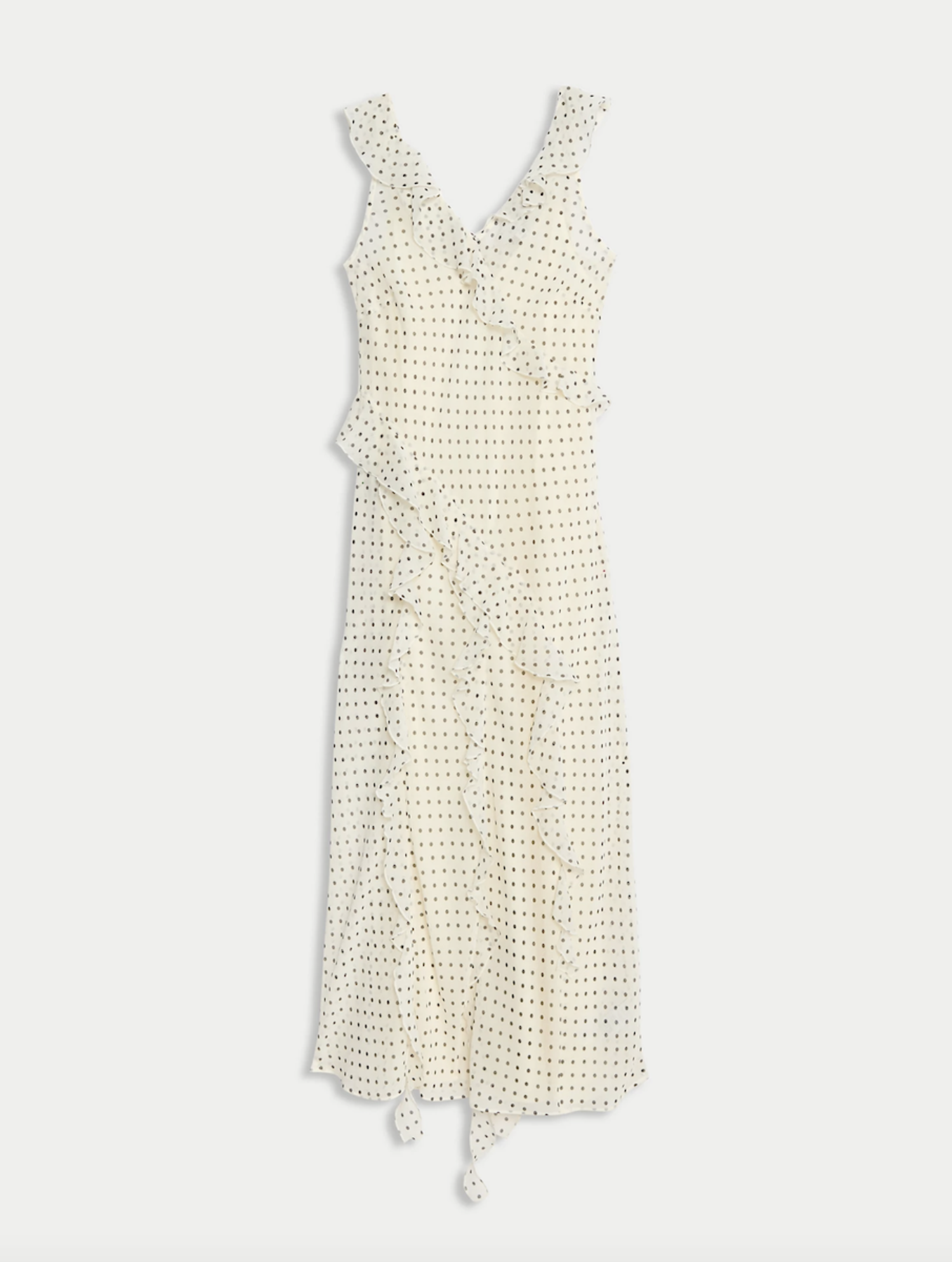 A long cream-colored dress with black polka dots, ruffled straps, and a ruffled front, hanging against a plain background.