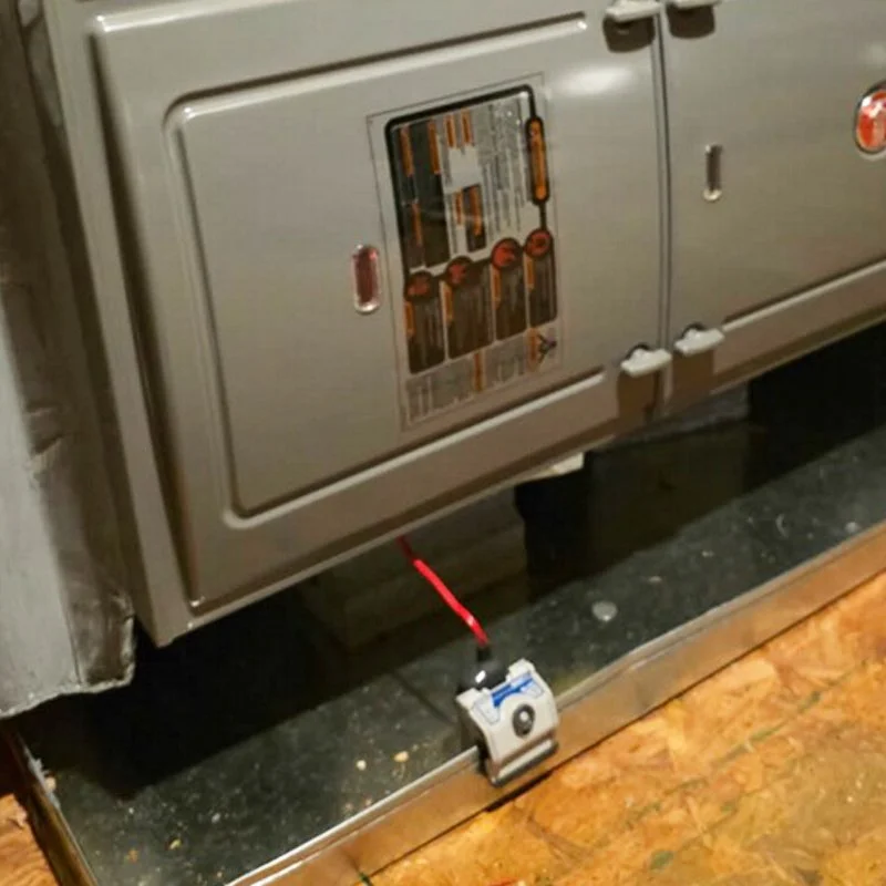 standard, code-required float switch inside a drip pan
