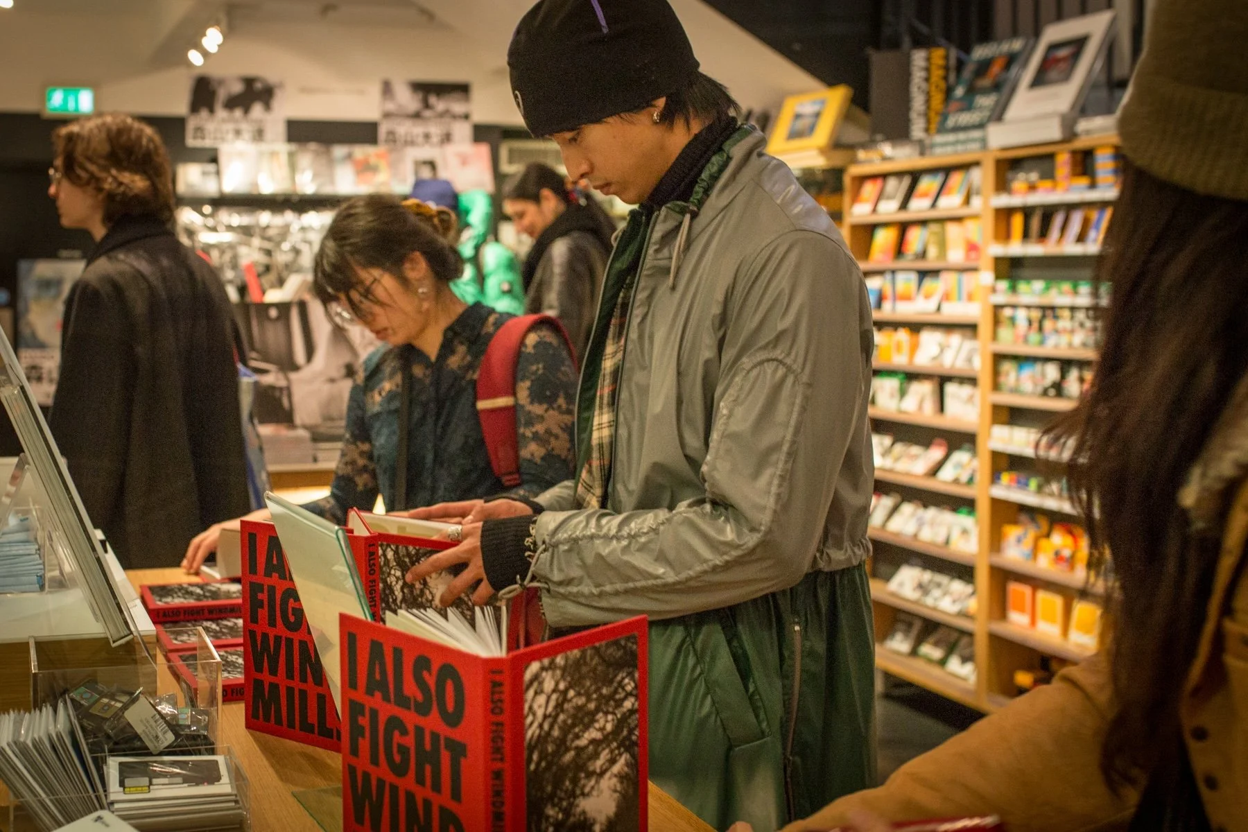 Visitors browsing copies of I Also Fight Windmills during the book launch.