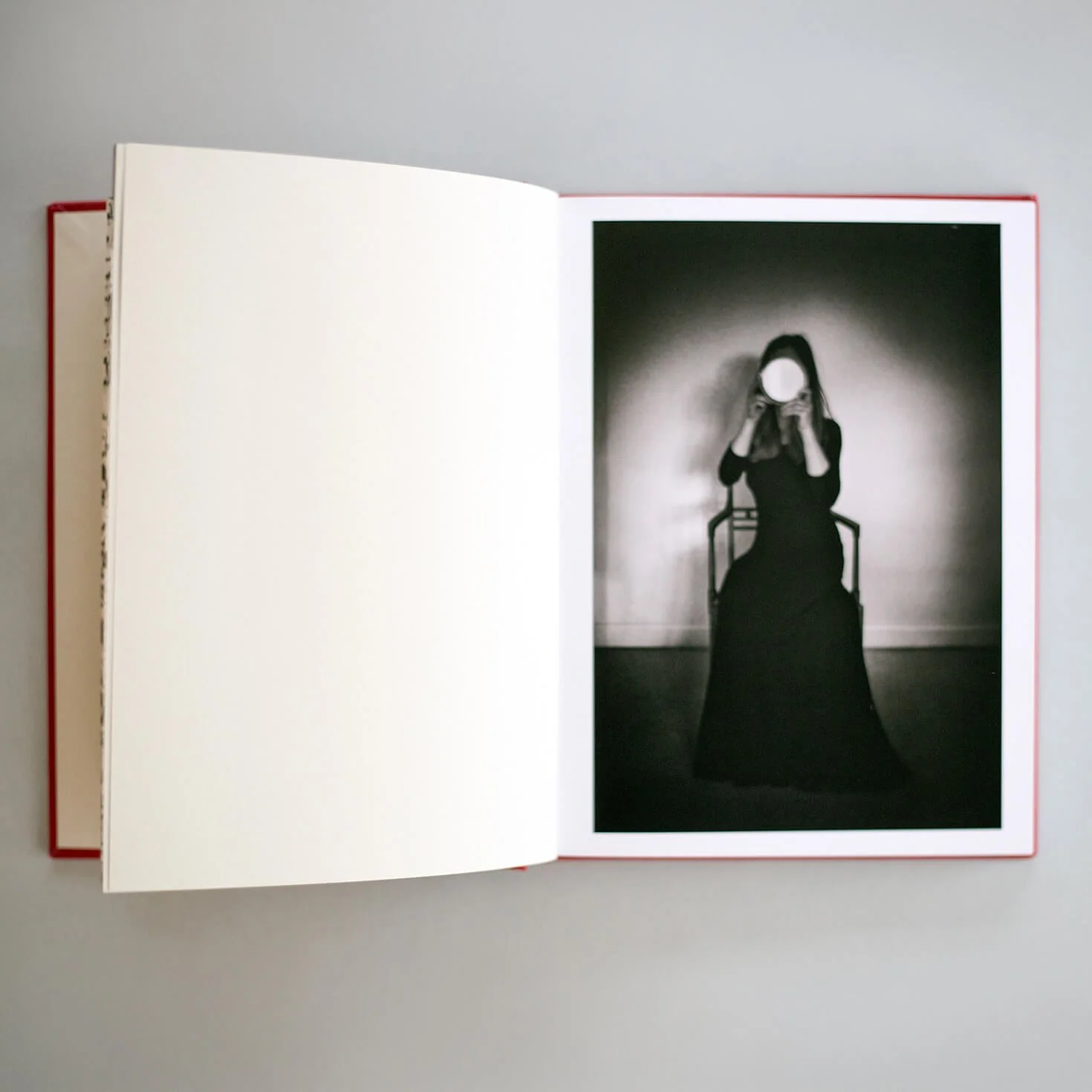 Open I Also Fight Windmills photobook showing a black-and-white self-portrait with a circular mirror.
