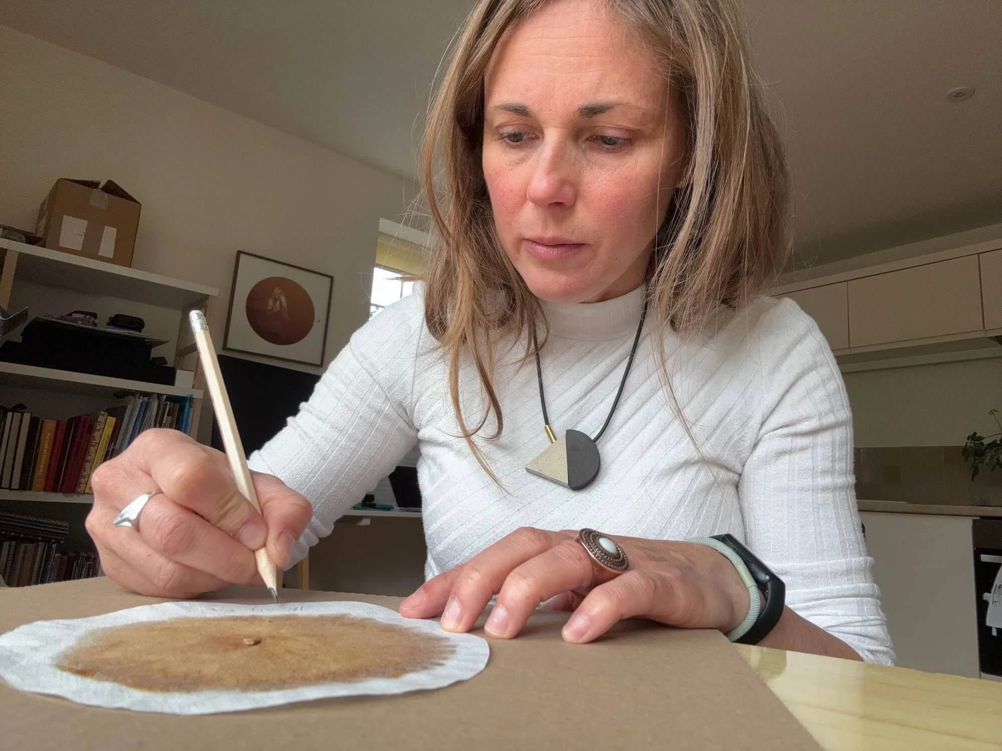 Ania Ready working with soil chromatography materials in her studio.