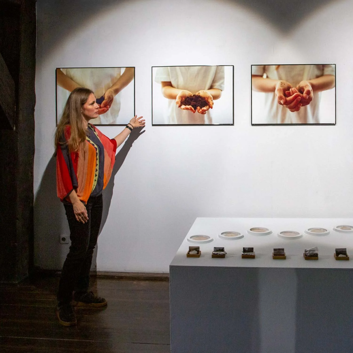 Ania Ready viewing an installation of her work in a gallery.
