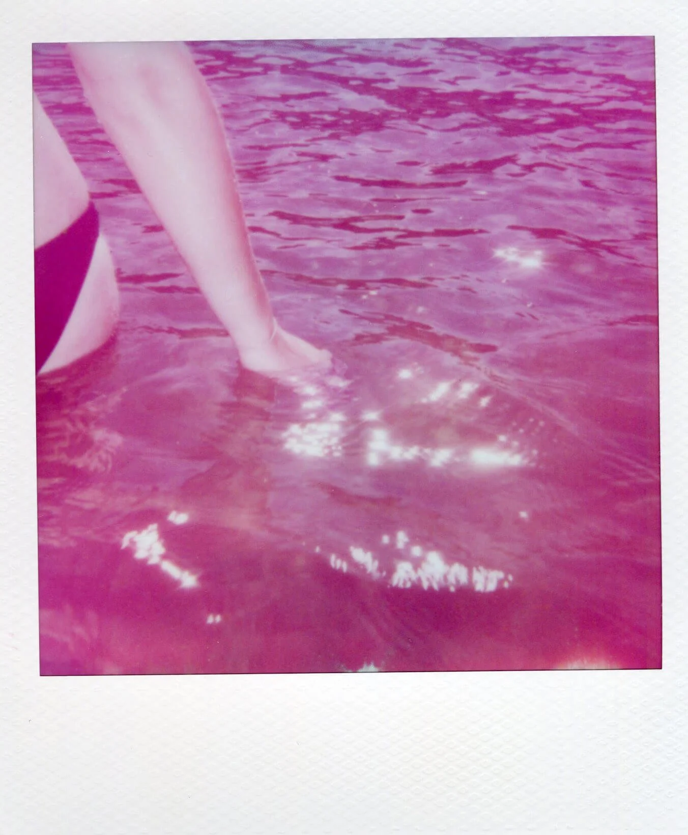 Detail of Water Mark (Baltic Sea), Entering, showing a figure’s arm and body entering rippling pink-tinted water.