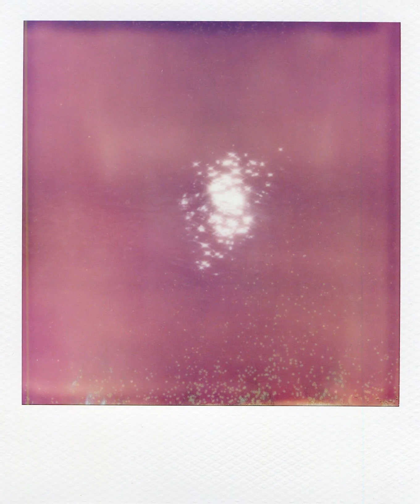 Detail of Water Mark (Rumia River), showing a bright reflection of light surrounded by soft pink river water.