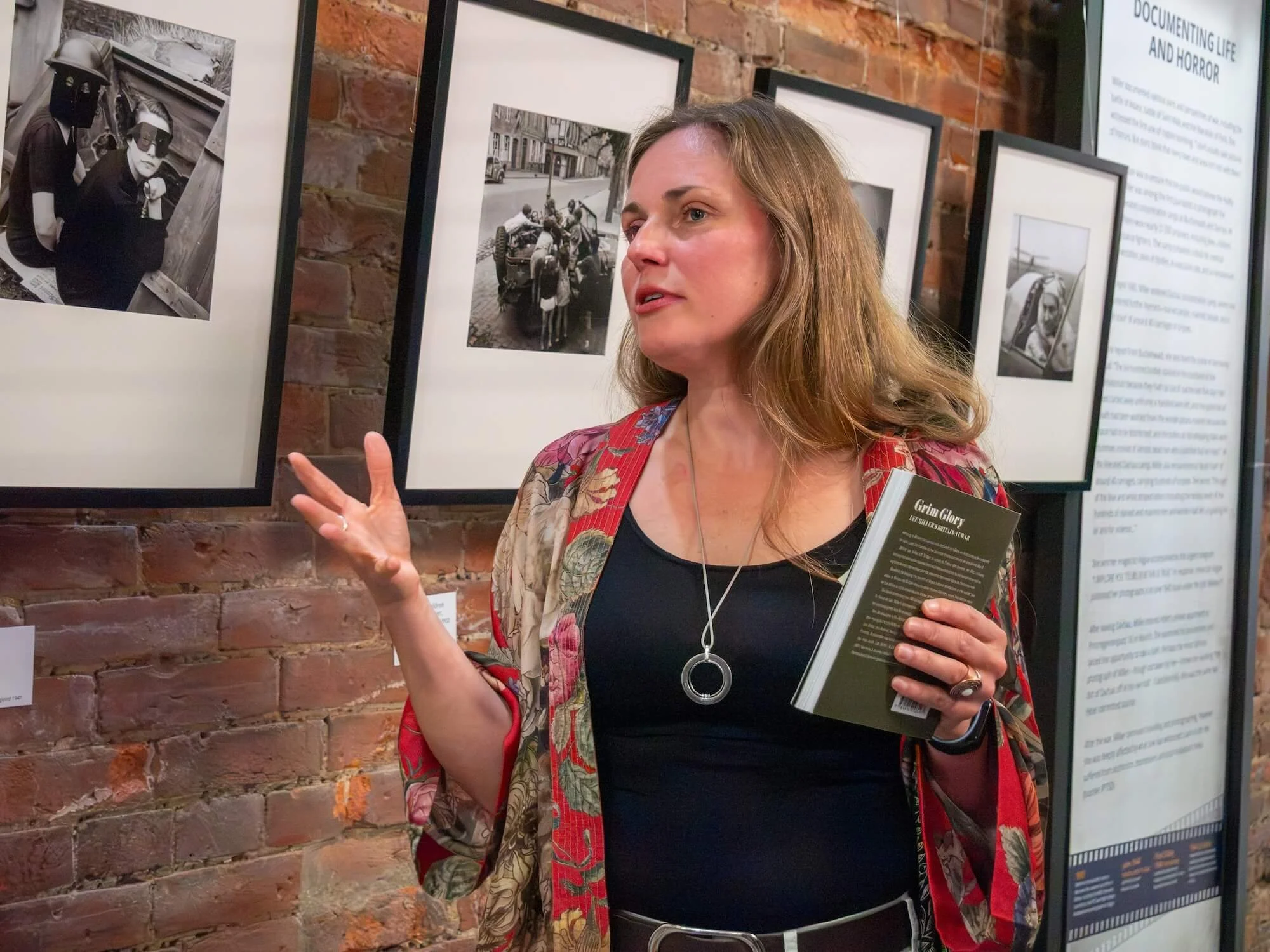 Ania Ready speaking to visitors during a tour of Lee Miller: A Woman at War.