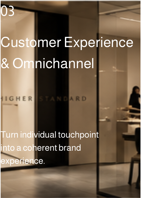 Text on a modern office window reads: 'Customer Experience & Omnichannel. Turn individual touchpoint into a coherent brand experience.'