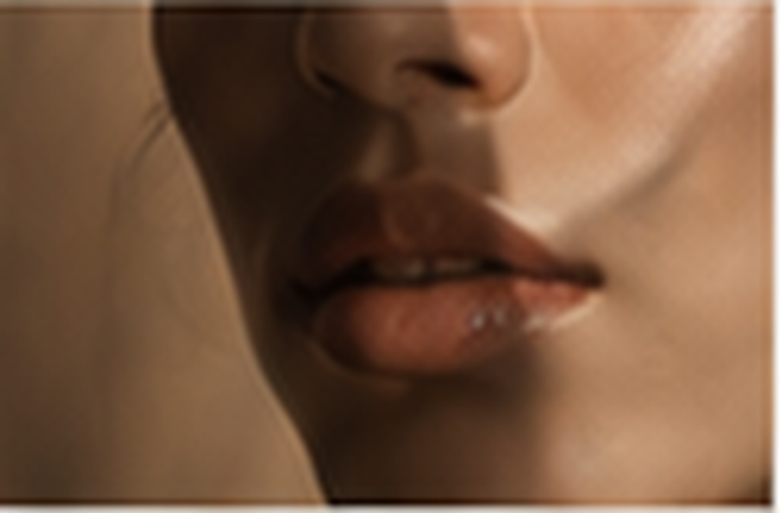 Close-up of a woman's lips and lower face.