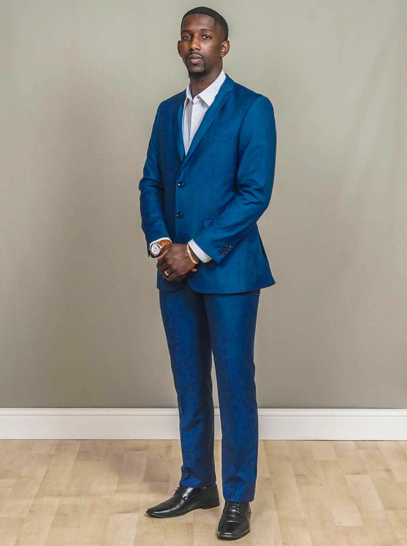 Full length portrait of WJ Daggins in a royal blue suit