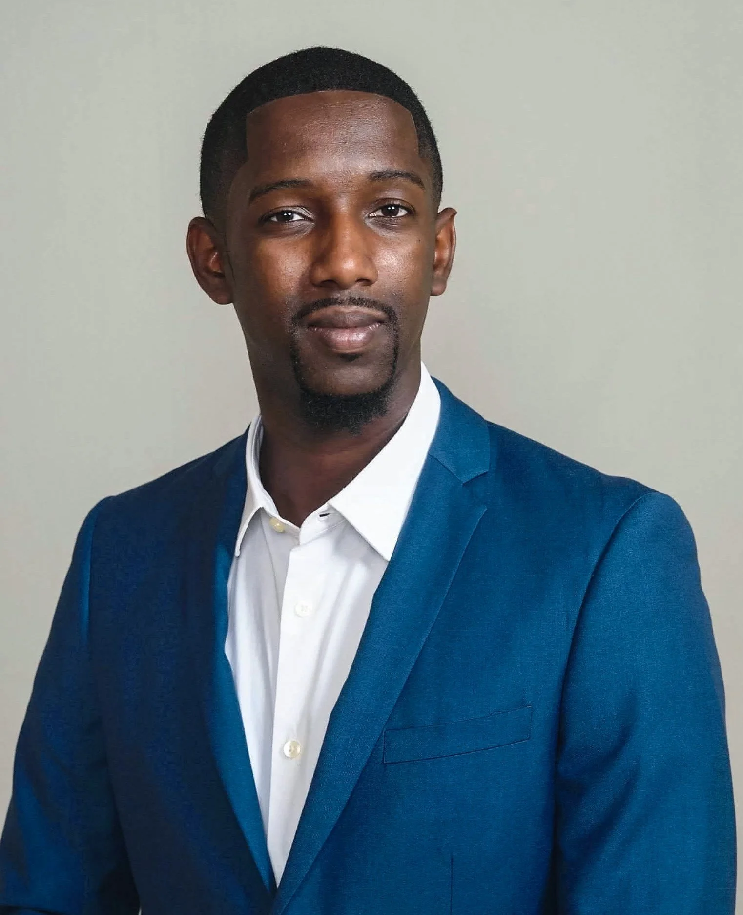 Portrait of WJ Daggins in a blue blazer and white shirt