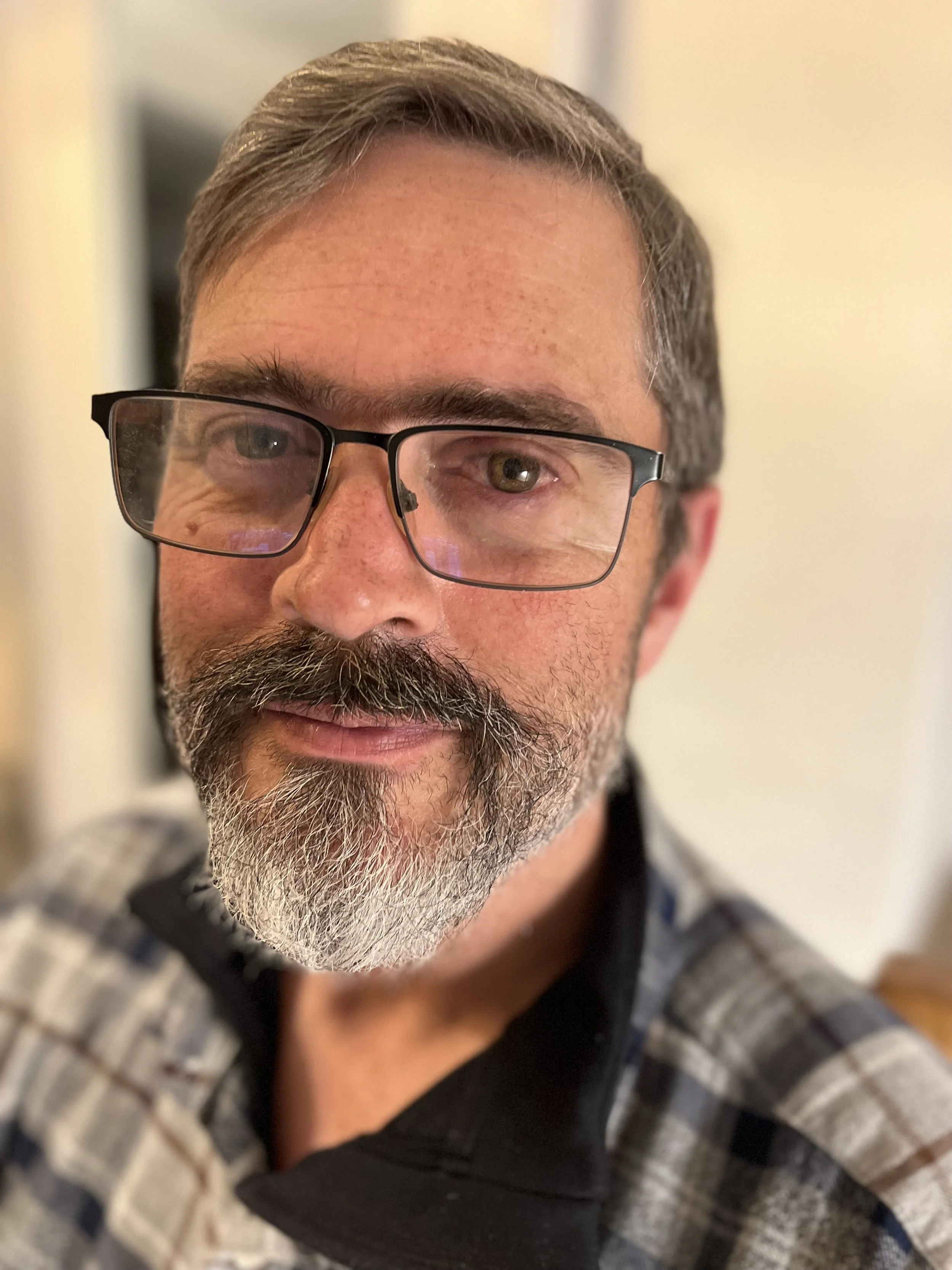 A very handsome man with beard and glasses