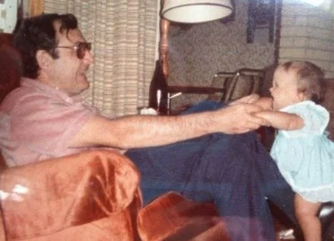 Tom Fischer and his baby daughter, Anne-Marie Fischer, Sarnia, Ontario, 1980s
