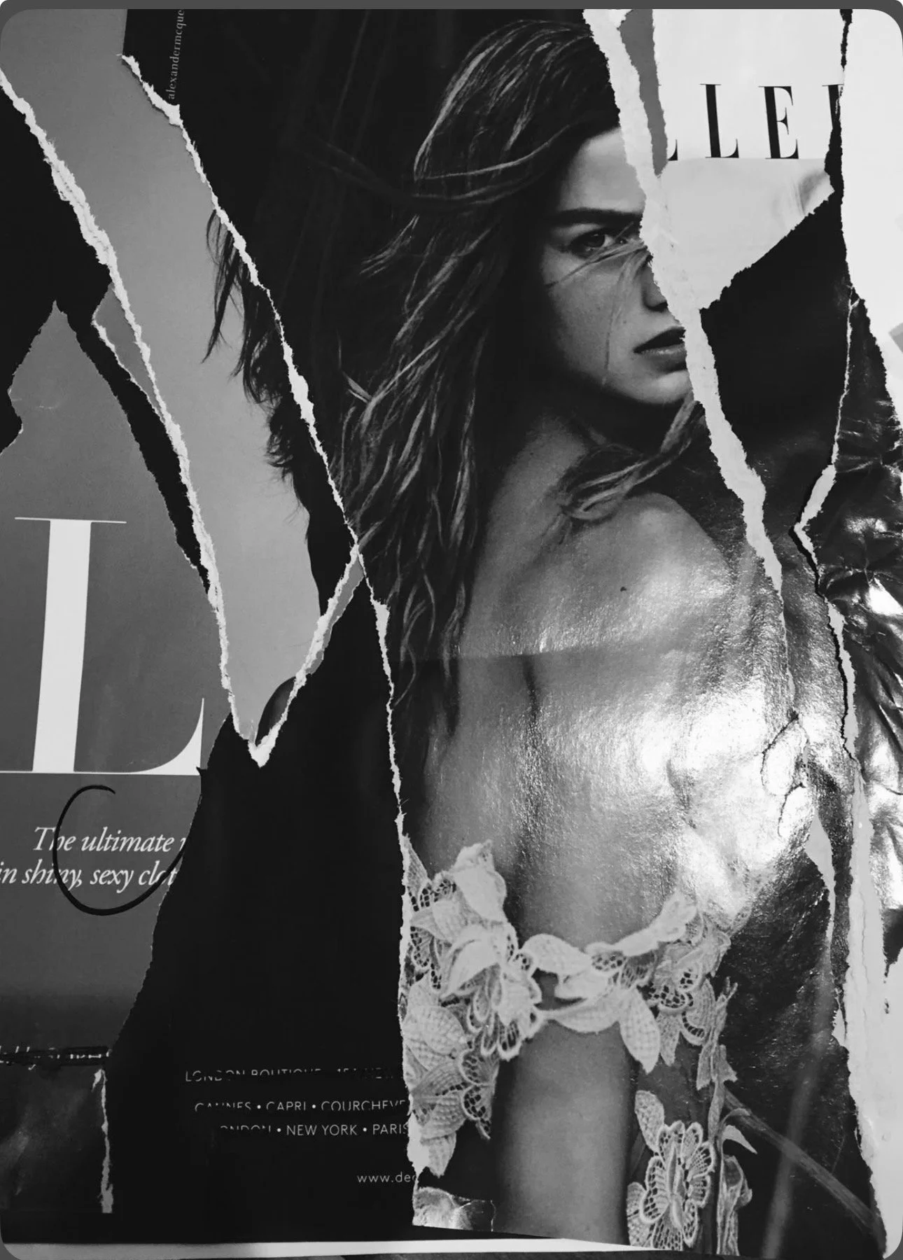 A black and white collage torn image featuring a woman with long hair in lingerie with lace details, partially obscured by torn paper.