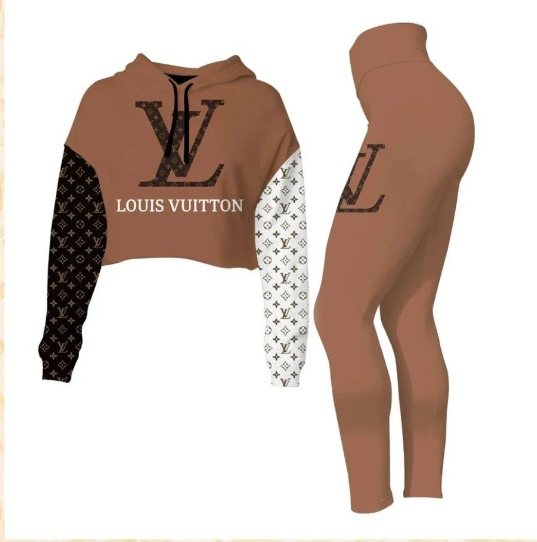 A coordinating Louis Vuitton women's loungewear set with a cropped hoodie and leggings. The hoodie features a large LV logo, with sleeves in black and white adorned with LV monogram patterns.