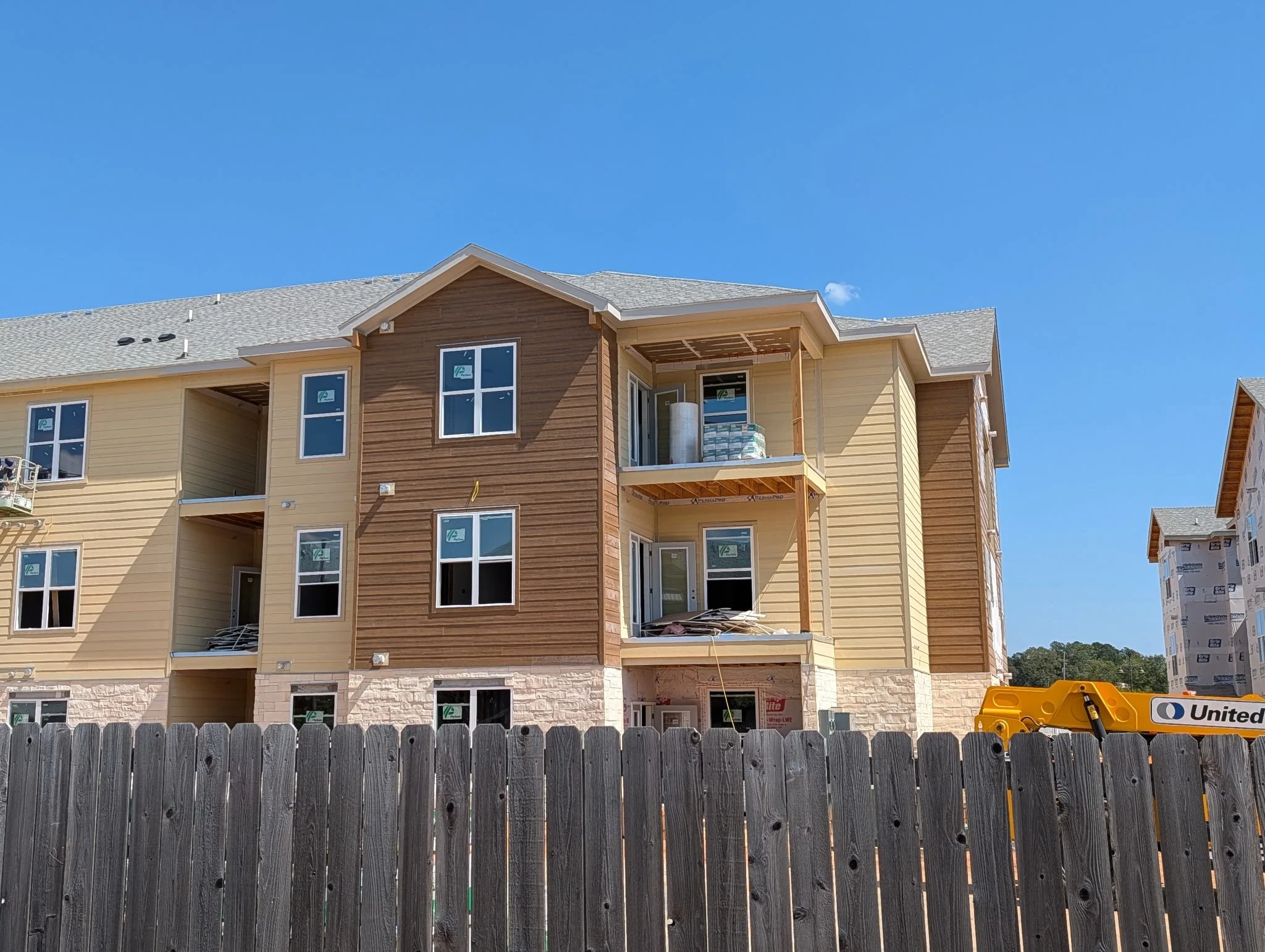 Multi-story apartment building exterior under construction at North Village Phase III in Ruston, LA