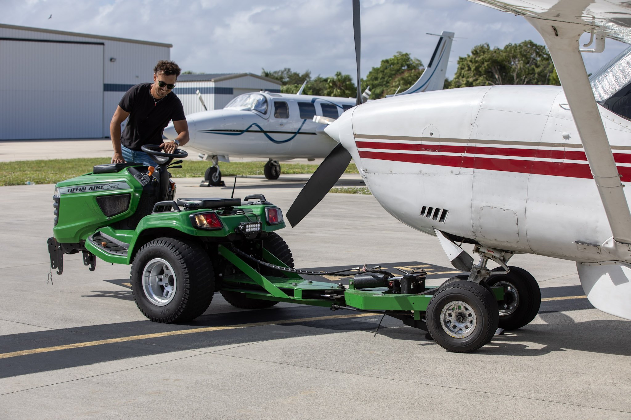 Plane travel ground crew moving Cessna caravan after refueling at pompano beach airpark