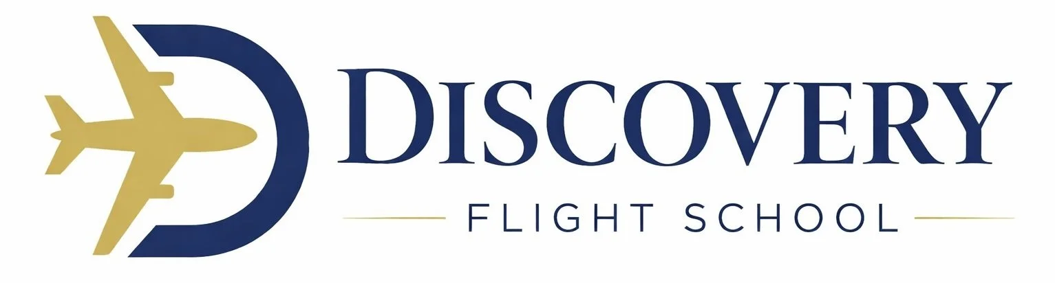 Logo of Discovery Flight School featuring a stylized airplane within a circular design next to the text 'Discovery Flight School'.