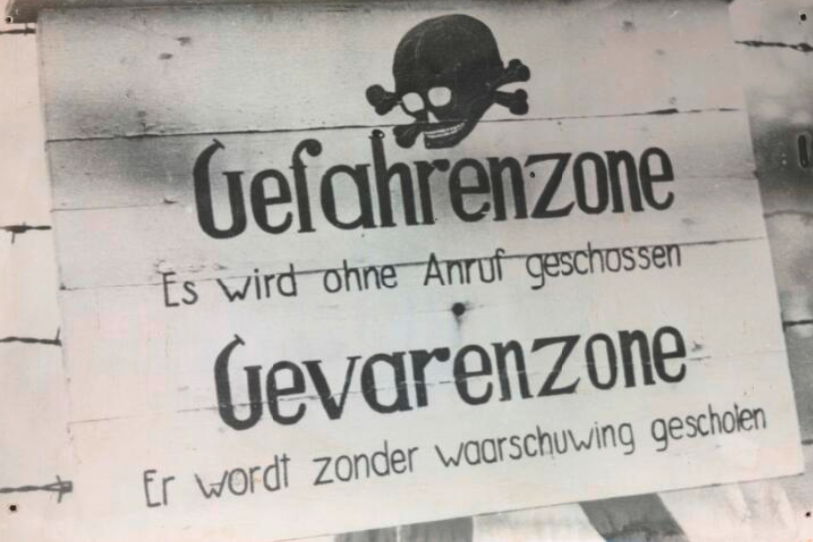 German and Dutch warning sign in the occupied Dutch coastal zone stating that unauthorized persons would be shot without warning