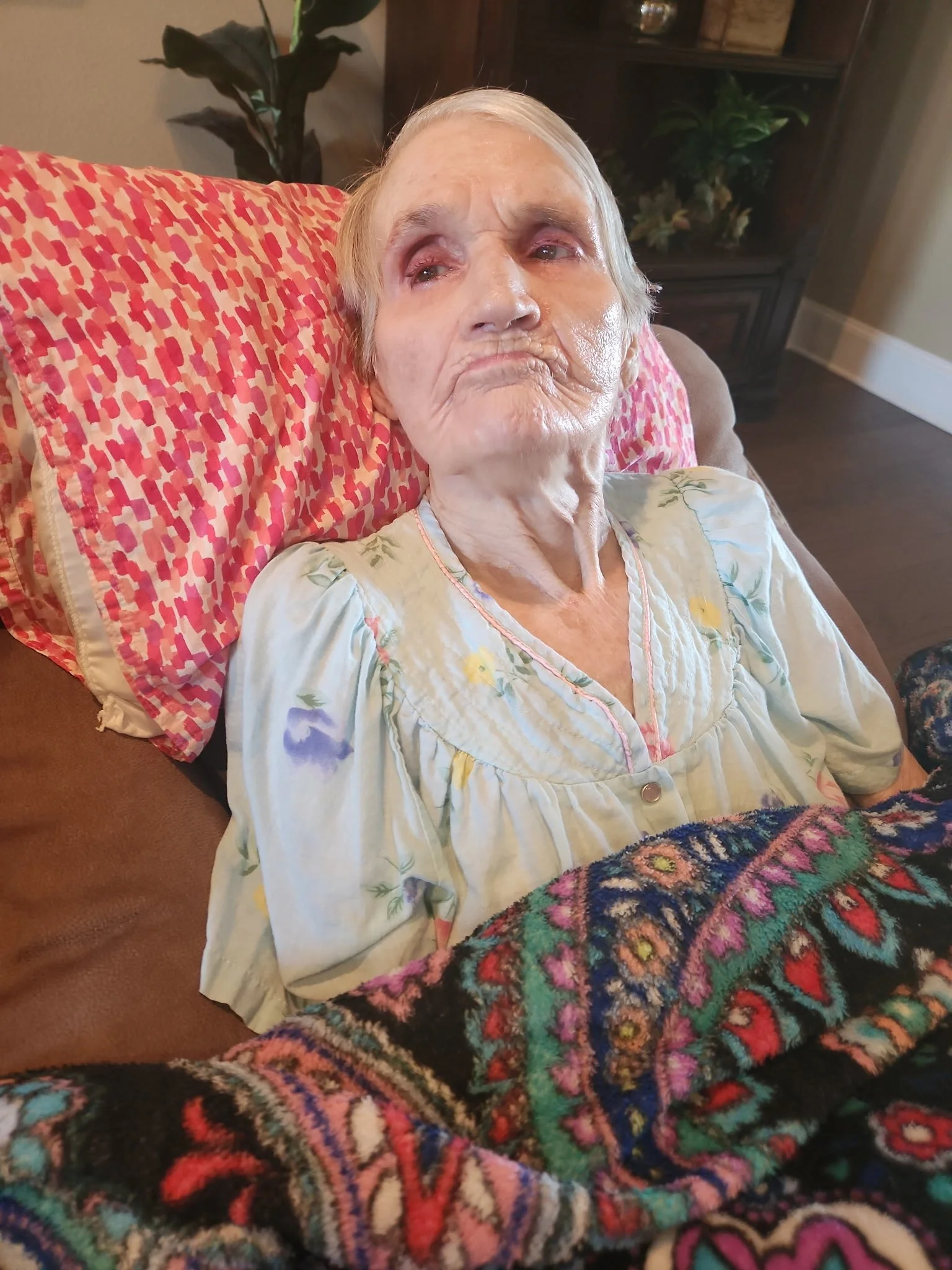 Resident enjoying a relaxed moment in her room at Selah Ridge care home