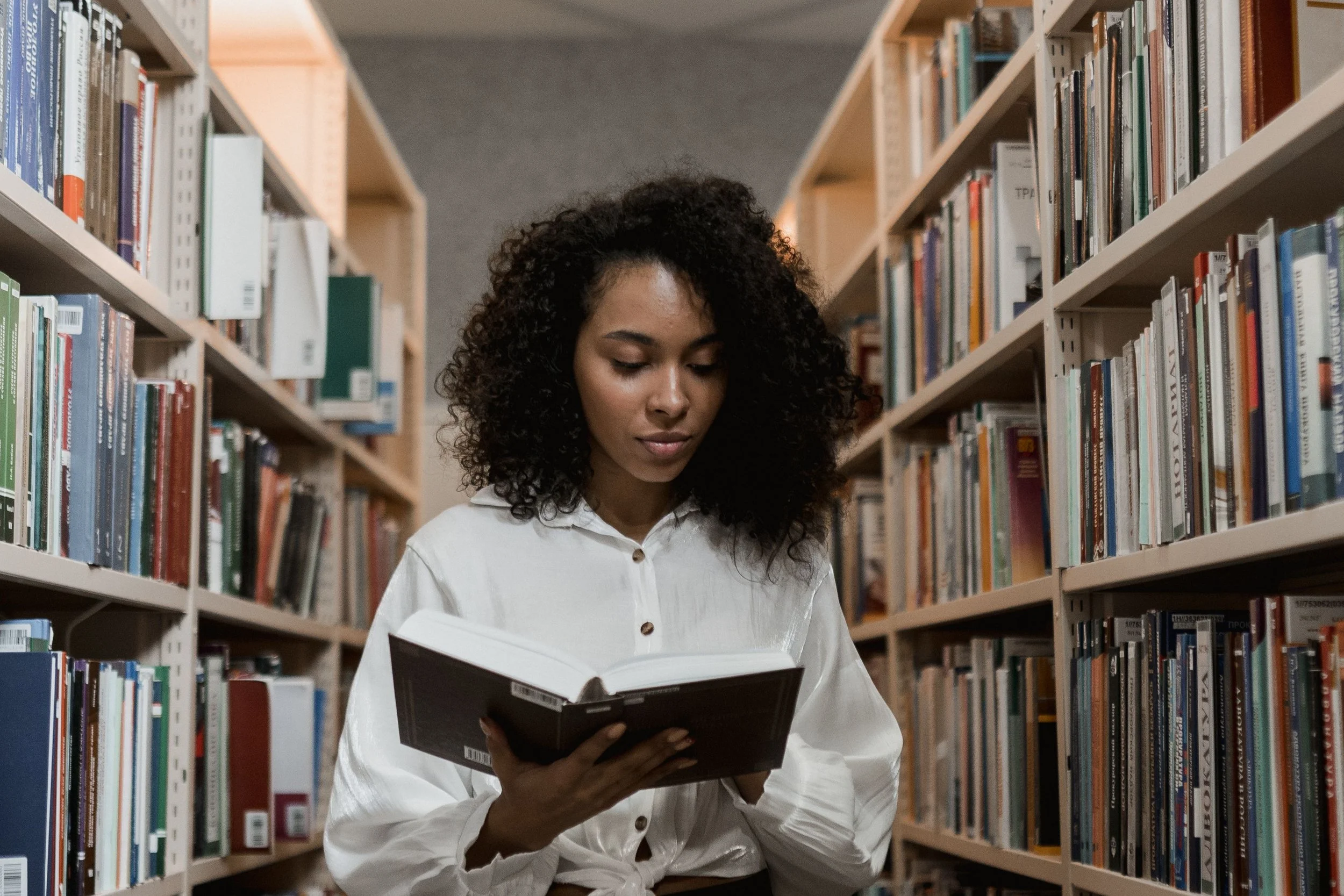 A picture of a woman holding a book