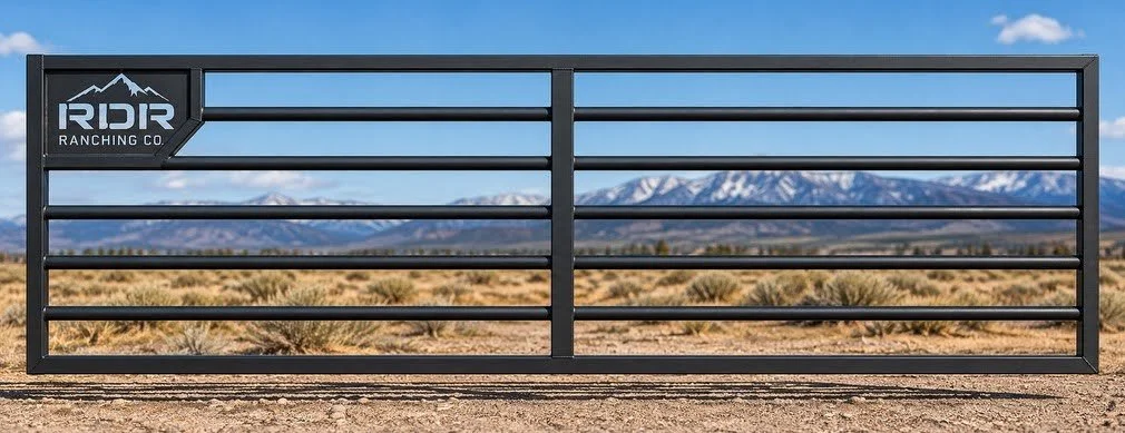 Black RDR Ranching Co. ranch gate in a desert landscape with snow-capped mountains