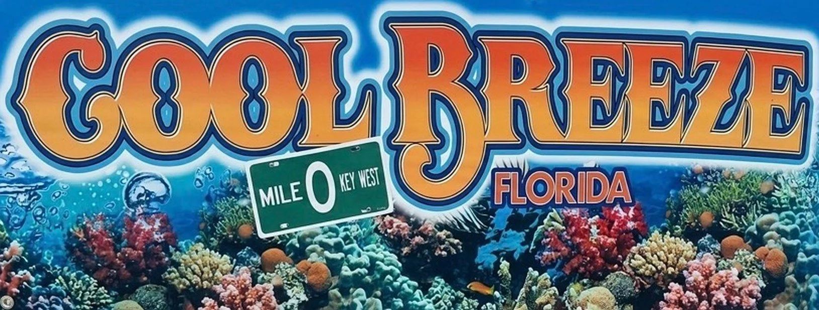 Cool Breeze Charters Key West vintage-style banner logo over a coral reef background