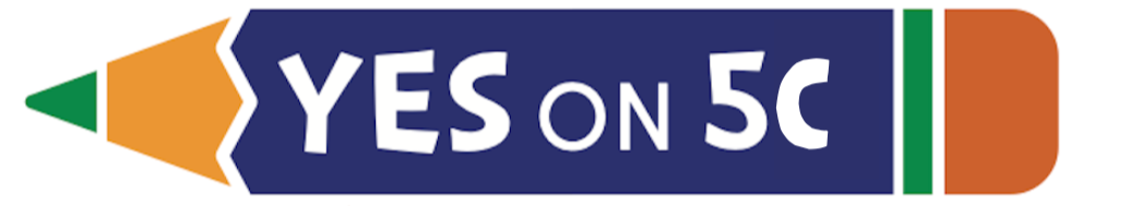 A promotional sign resembling a crayon with the text 'YES ON 5C' on a dark blue background, with green and orange accents.