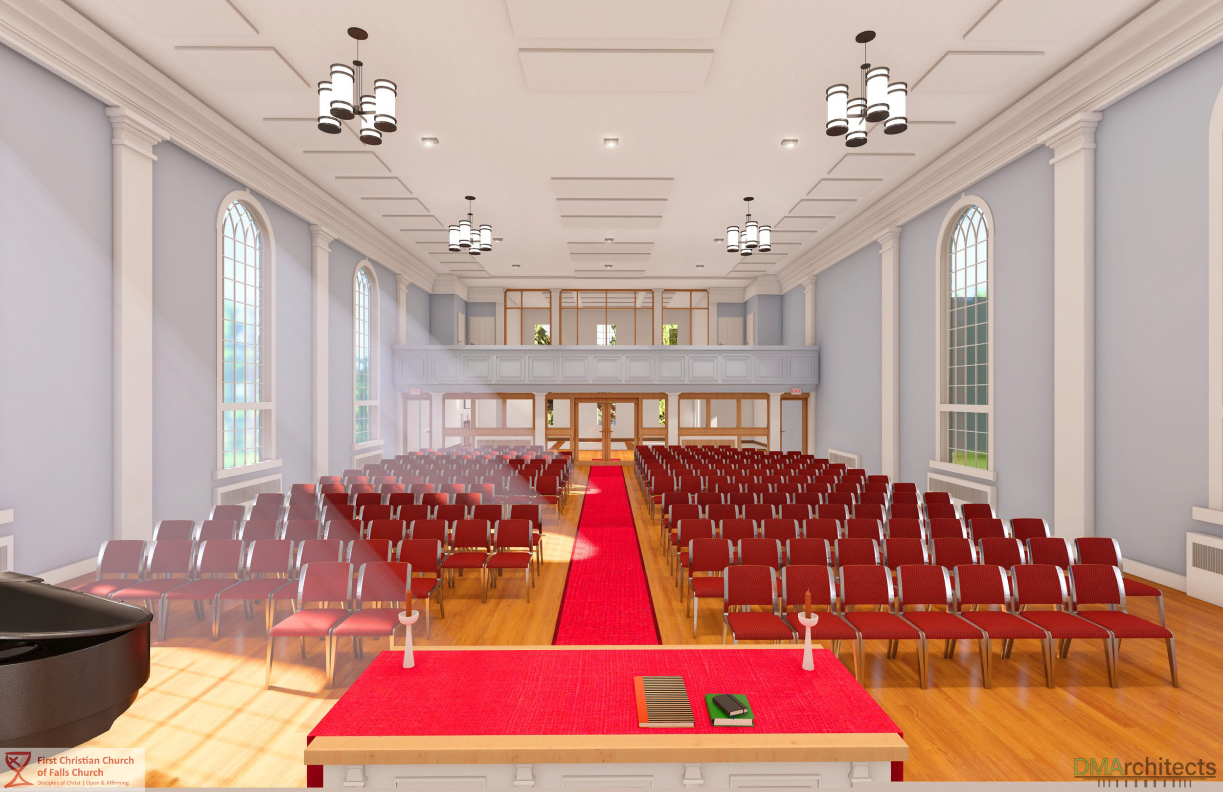 Interior of a church auditorium with red chairs arranged in rows, a red carpet aisle leading to a stage, large windows, and chandeliers hanging from the ceiling.
