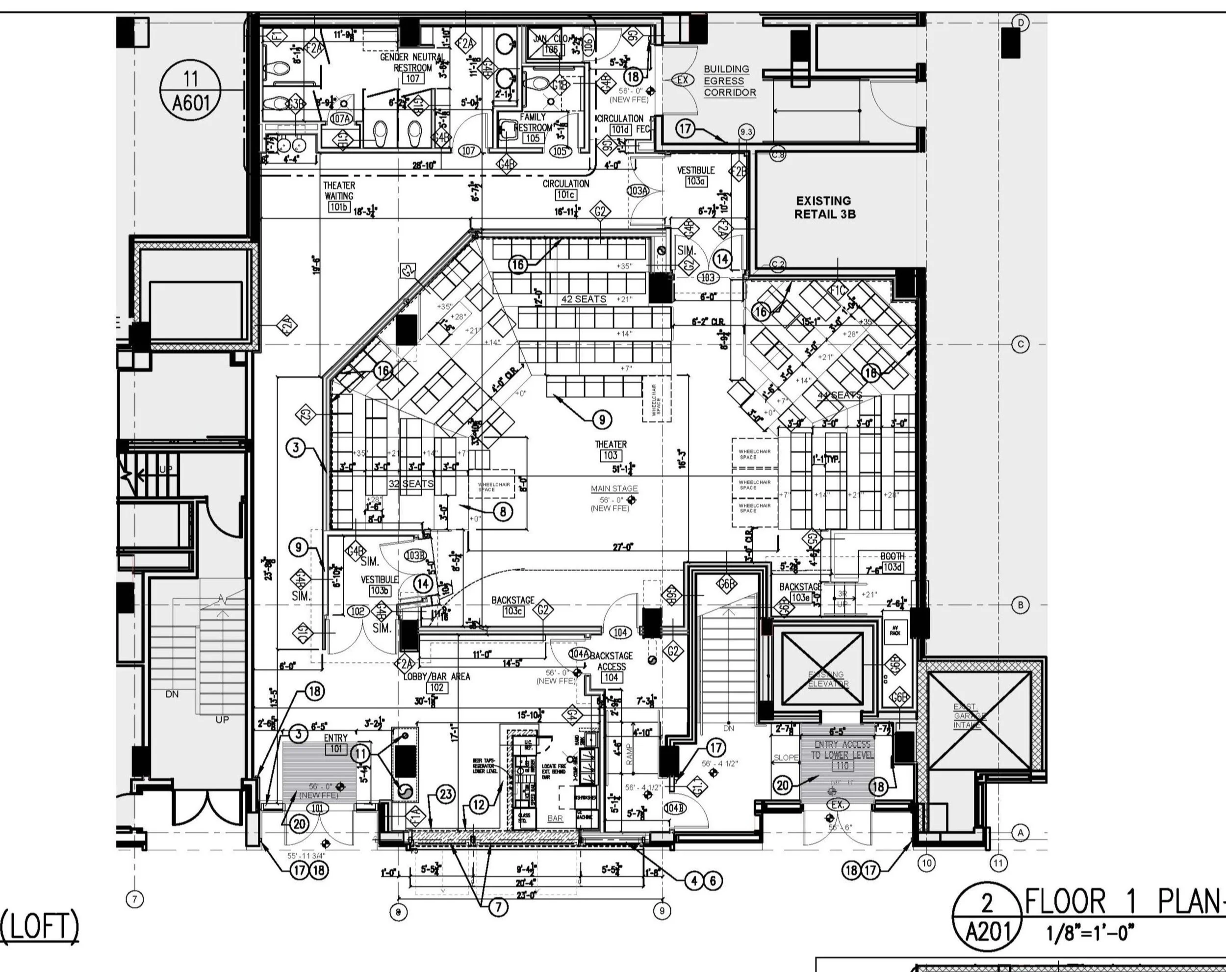 Detailed architectural floor plan of a building's first floor, including rooms such as restrooms, theater area, lobby/bar, and storage, with measurements and annotations.
