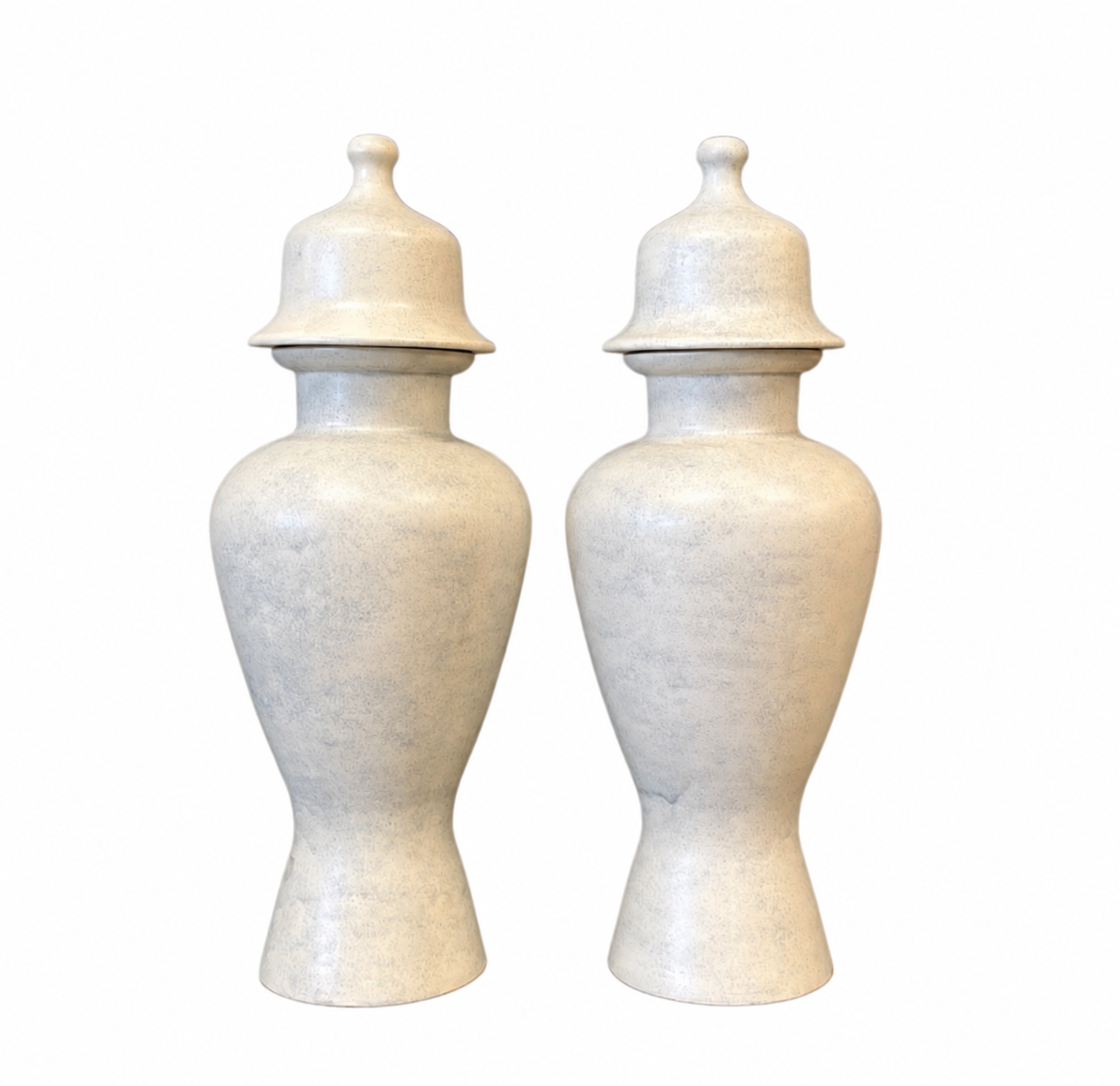 Two matching beige ceramic vases with lids, side by side, on a white background.