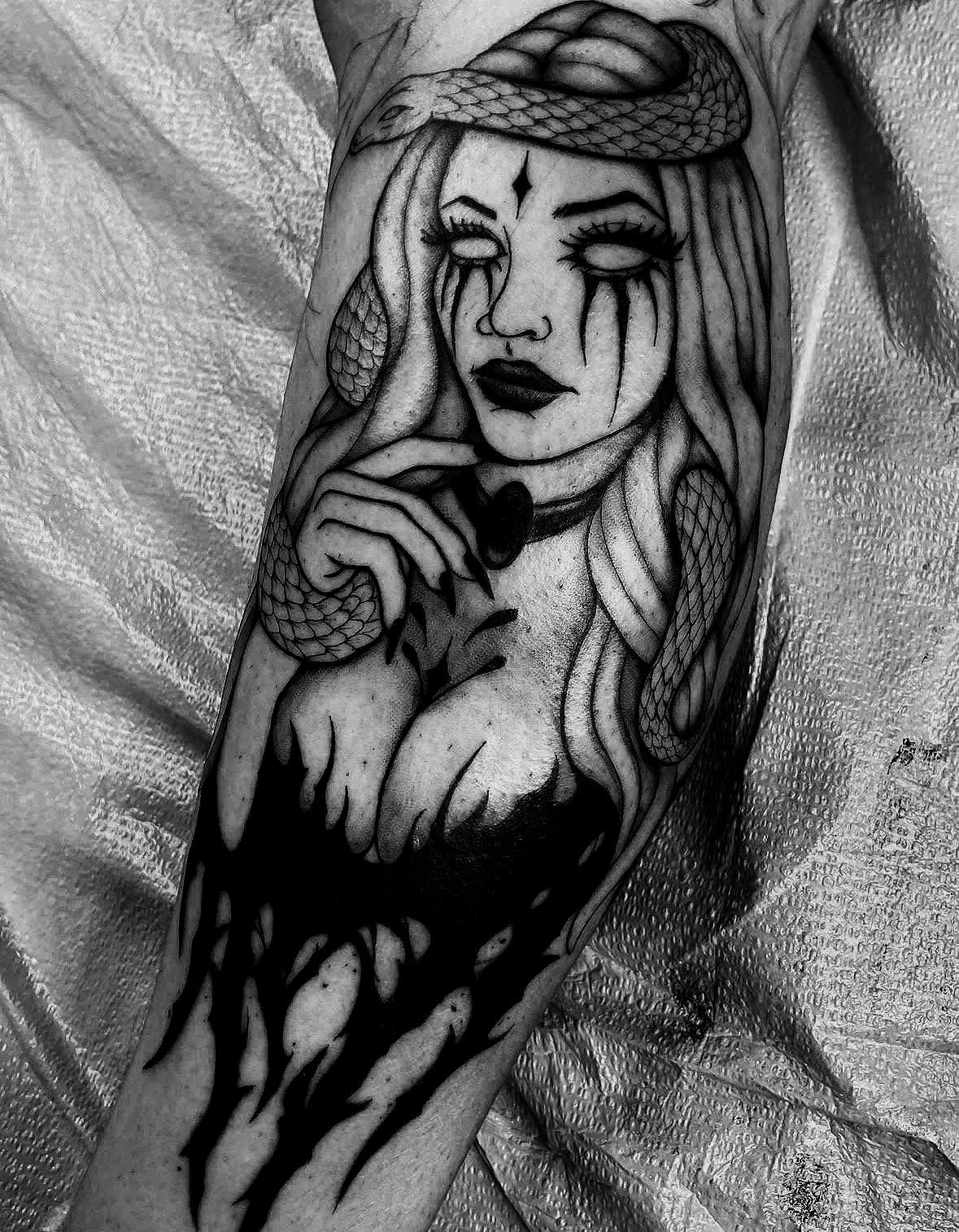 Blackwork woman portrait with snake tattoo by Agua at Floating Streams Tattoo