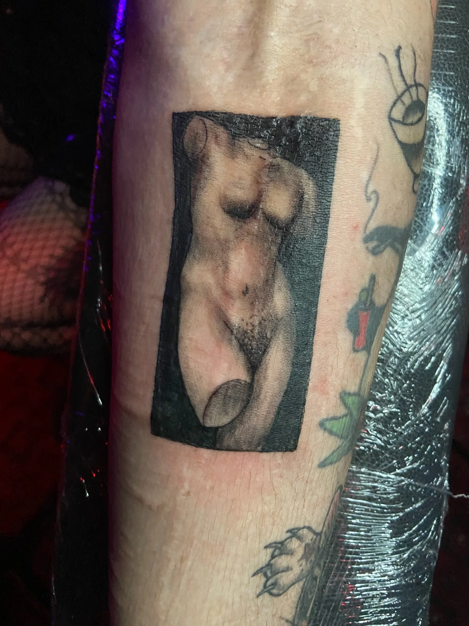 Tattoo of a girl with long hair on a person's arm.