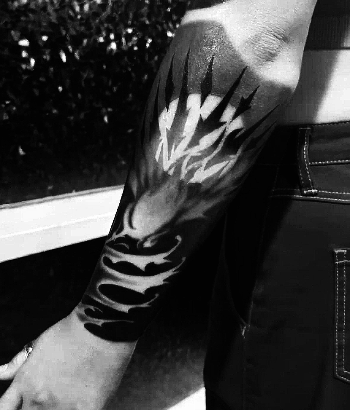 Blackwork abstract flame forearm tattoo by Agua