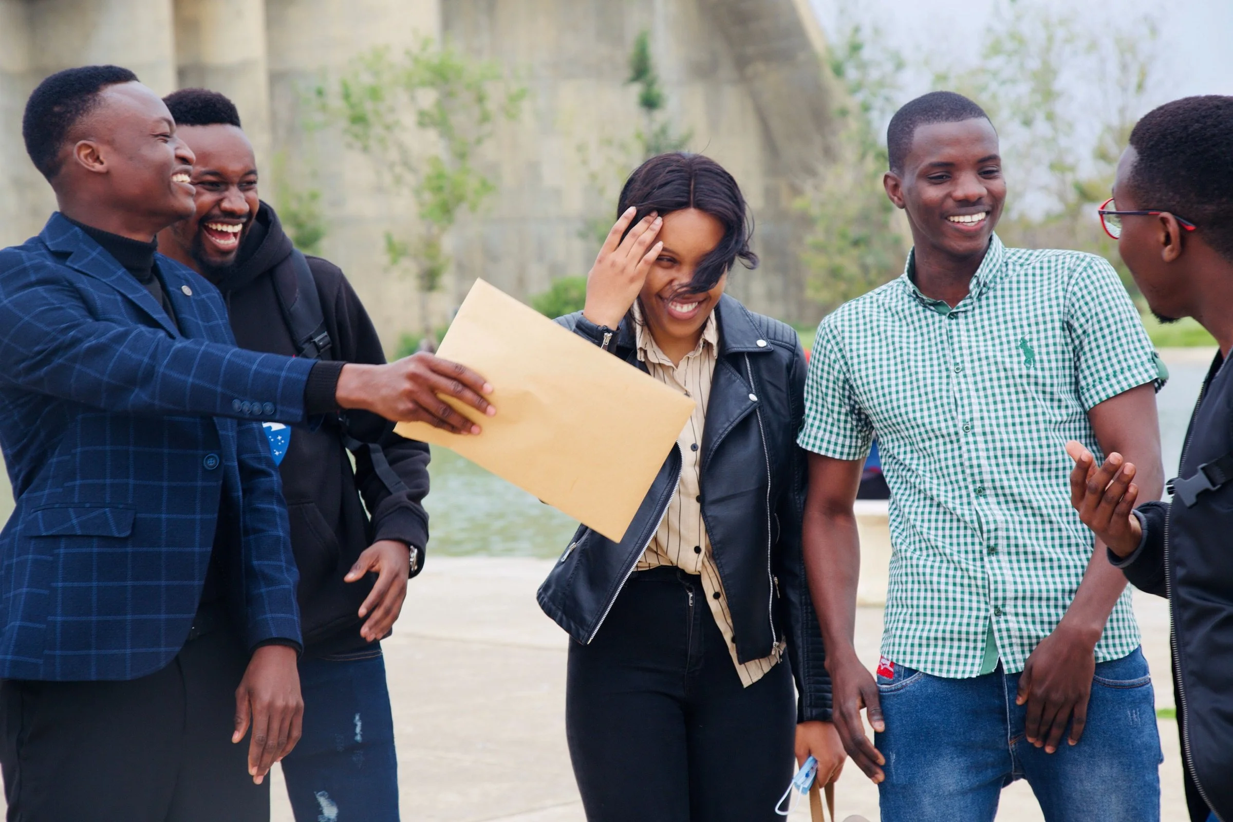 A group of friends laughing together outdoors