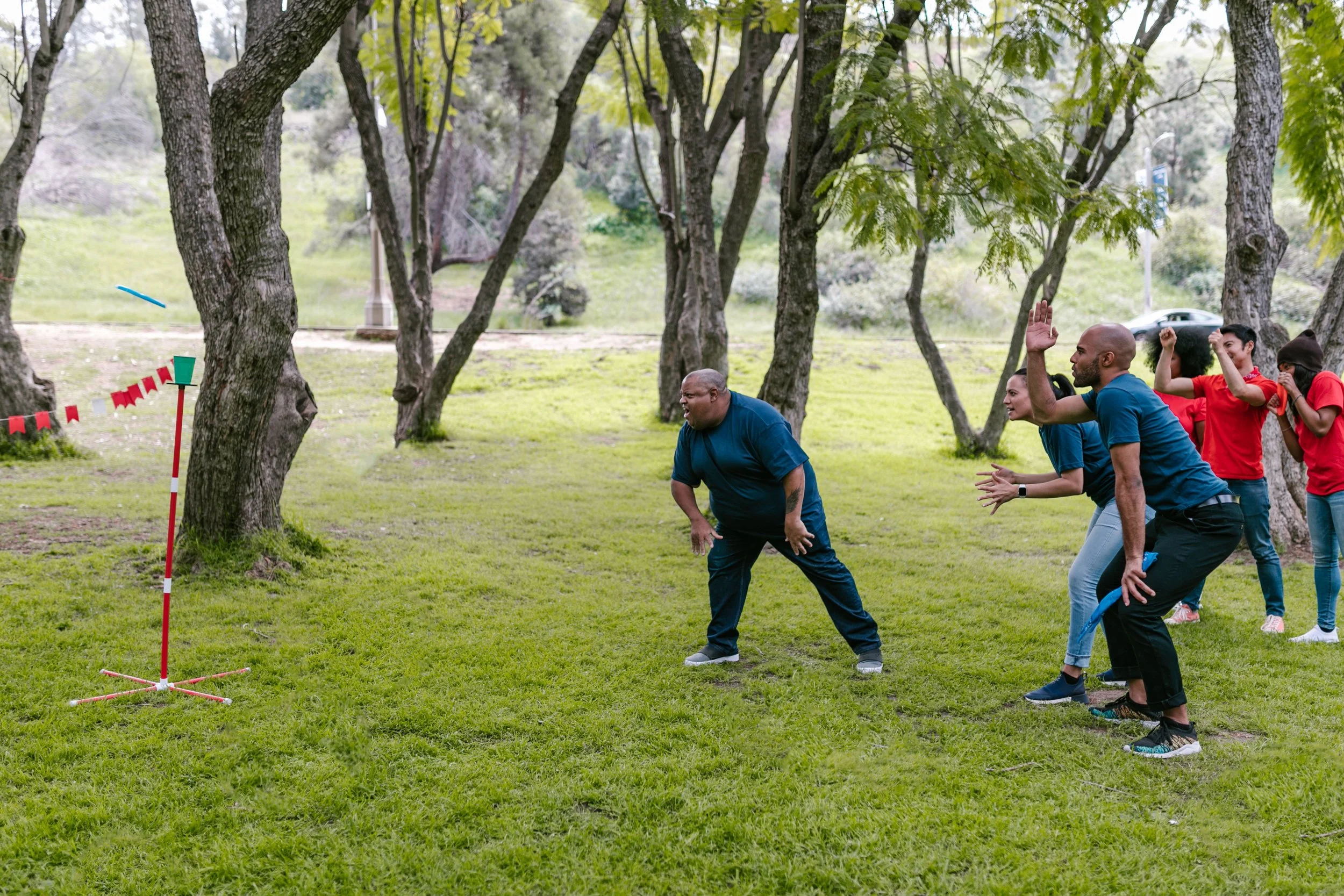 Adults taking part in an energetic outdoor team game