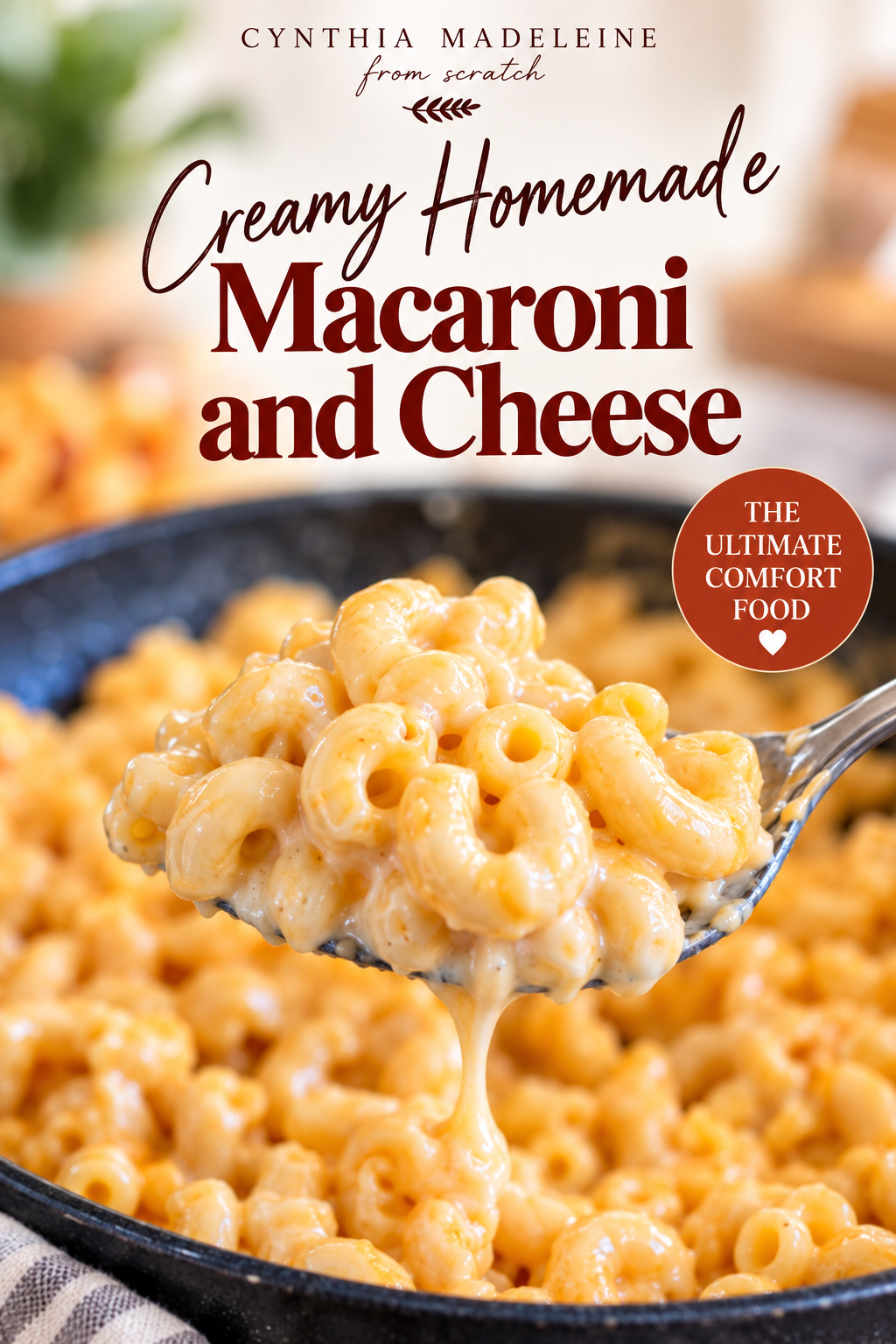 Creamy homemade macaroni and cheese served from a skillet with a spoon
