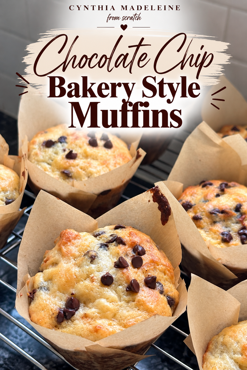 Homemade bakery-style chocolate chip muffins with golden tops and chocolate chips