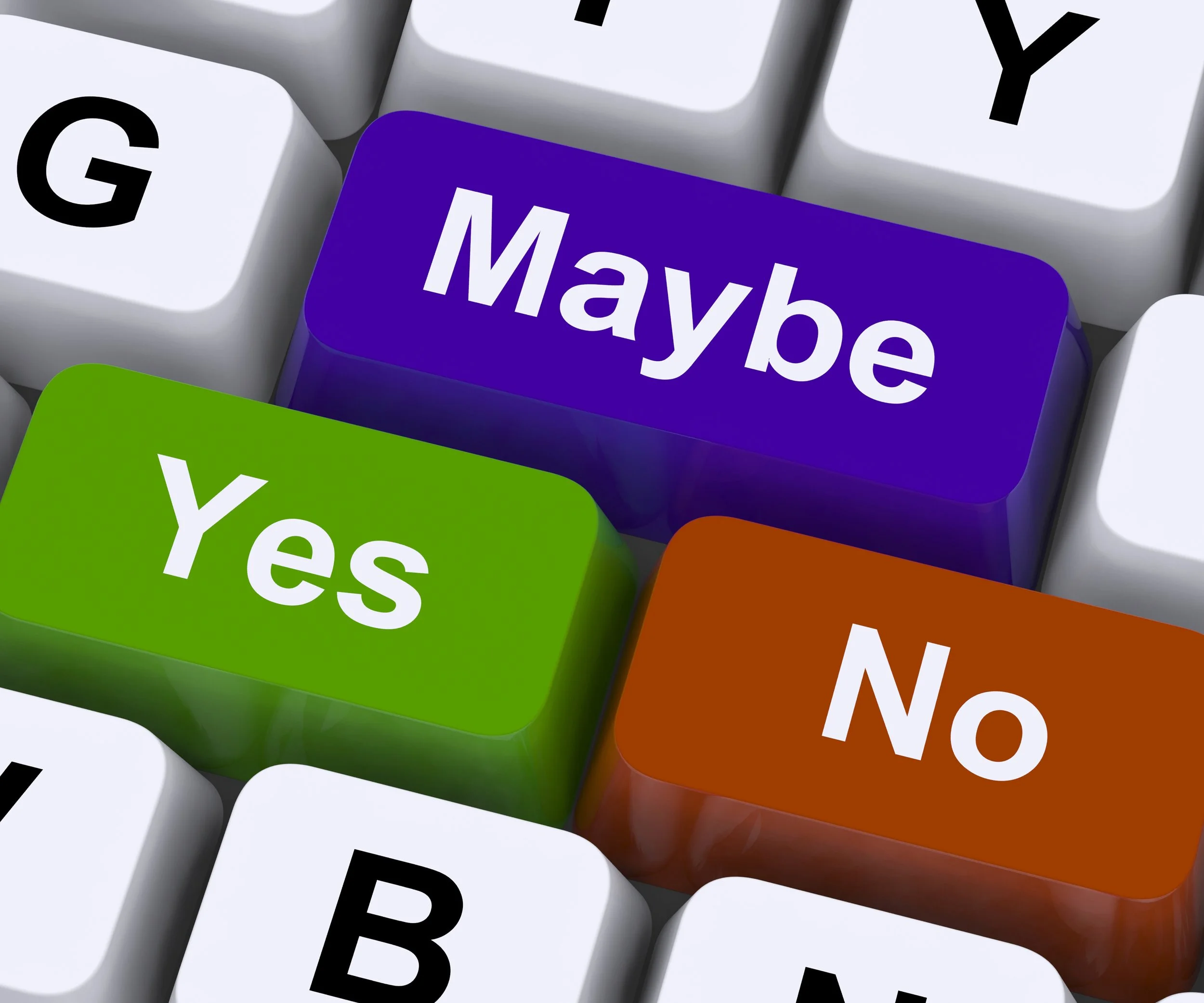 Close-up of colorful computer keyboard keys with messages 'Maybe', 'Yes', and 'No' in purple, green, and orange keycaps.