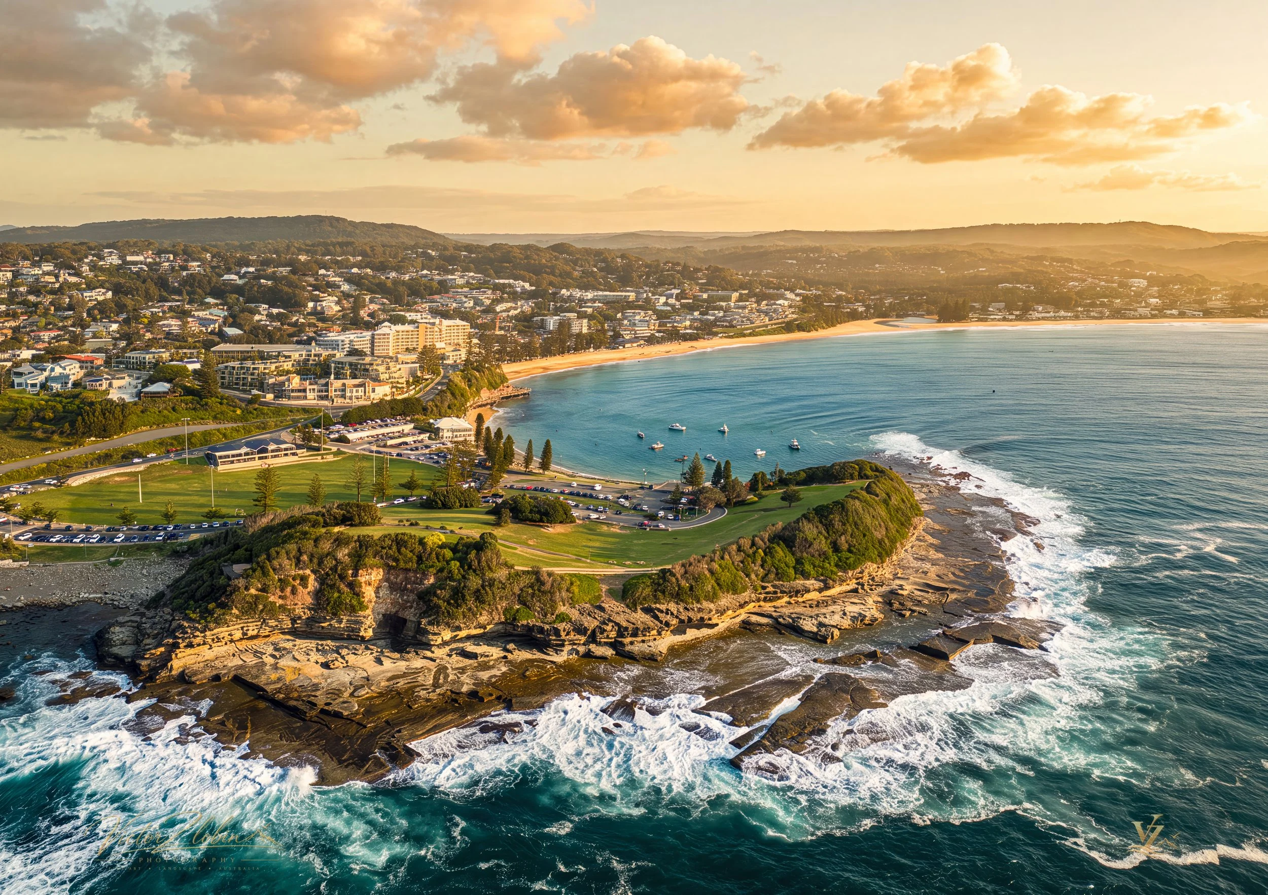 The Skillion overlooking the rugged Terrigal coastline as golden evening light meets the breaking waves. 0749