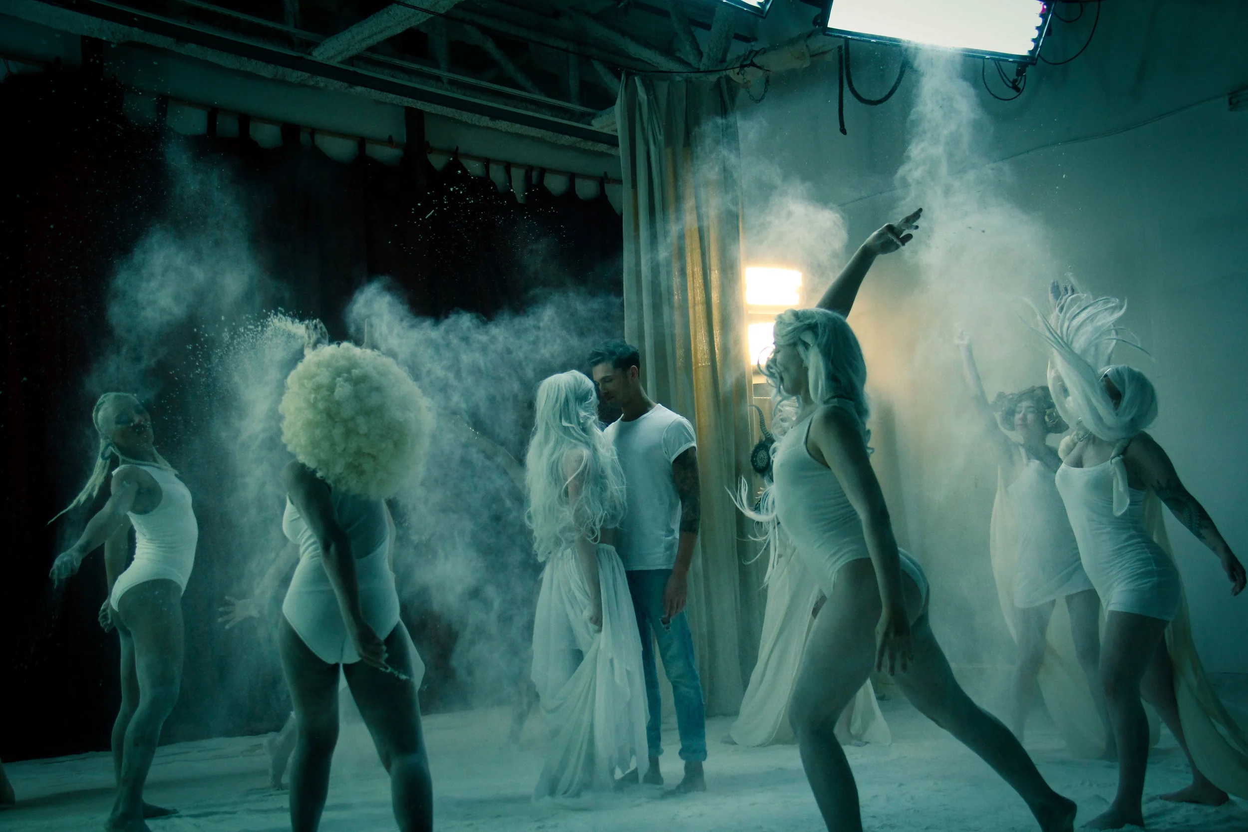 The final scene with the dancers surrounding the main characters.