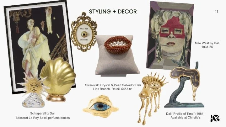 Collection of decorative and artistic objects including a vintage portrait, a gold shell-shaped sculpture, a Swarovski crystal and pearl lips brooch, a colorful painting of a woman with sunglasses, a gold sun mask, an eye sculpture, and a twisted bla