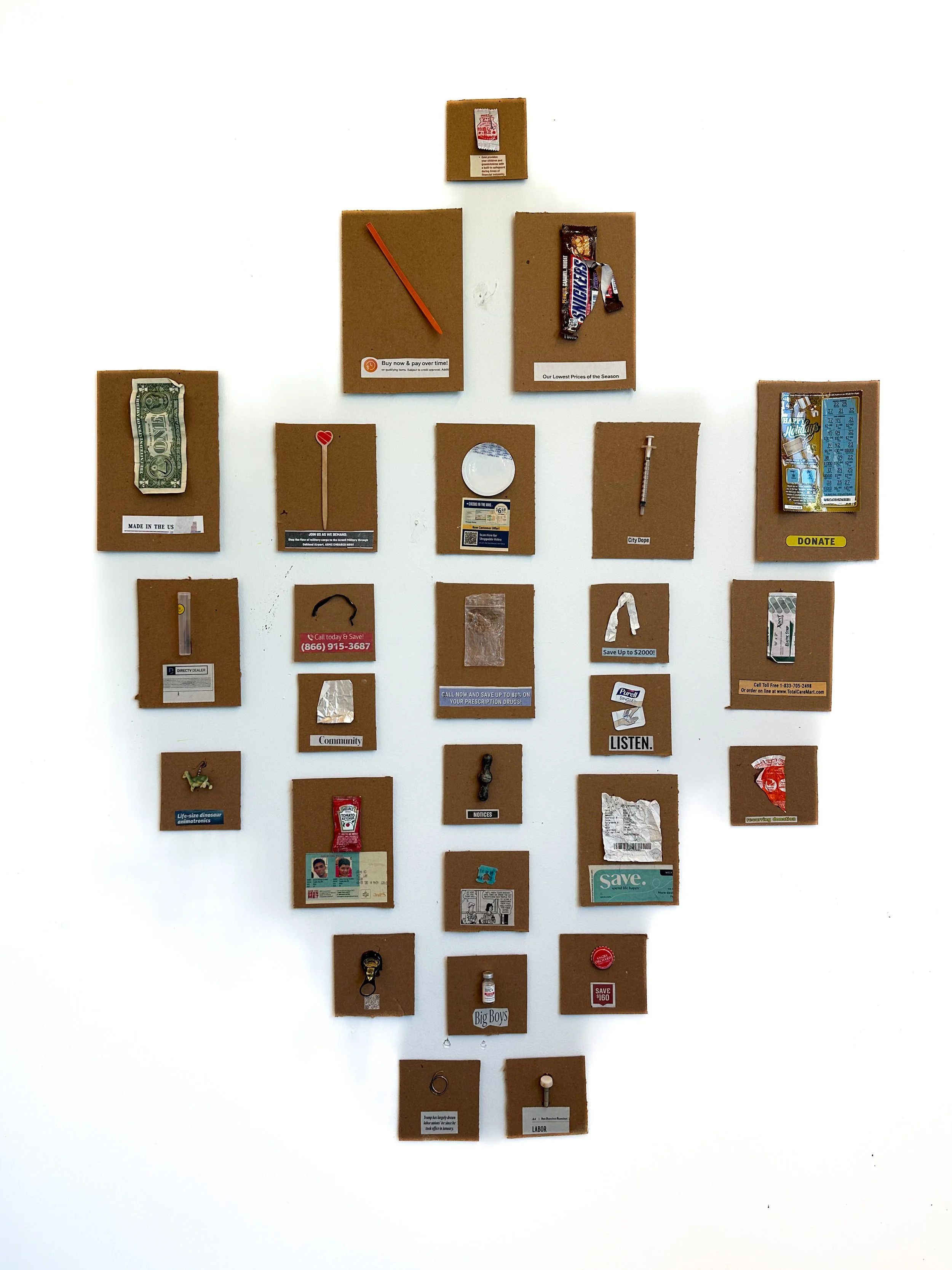 "Collection 1," 2026 found and discarded objects, trash, newspaper clipping, epoxy, velcro 