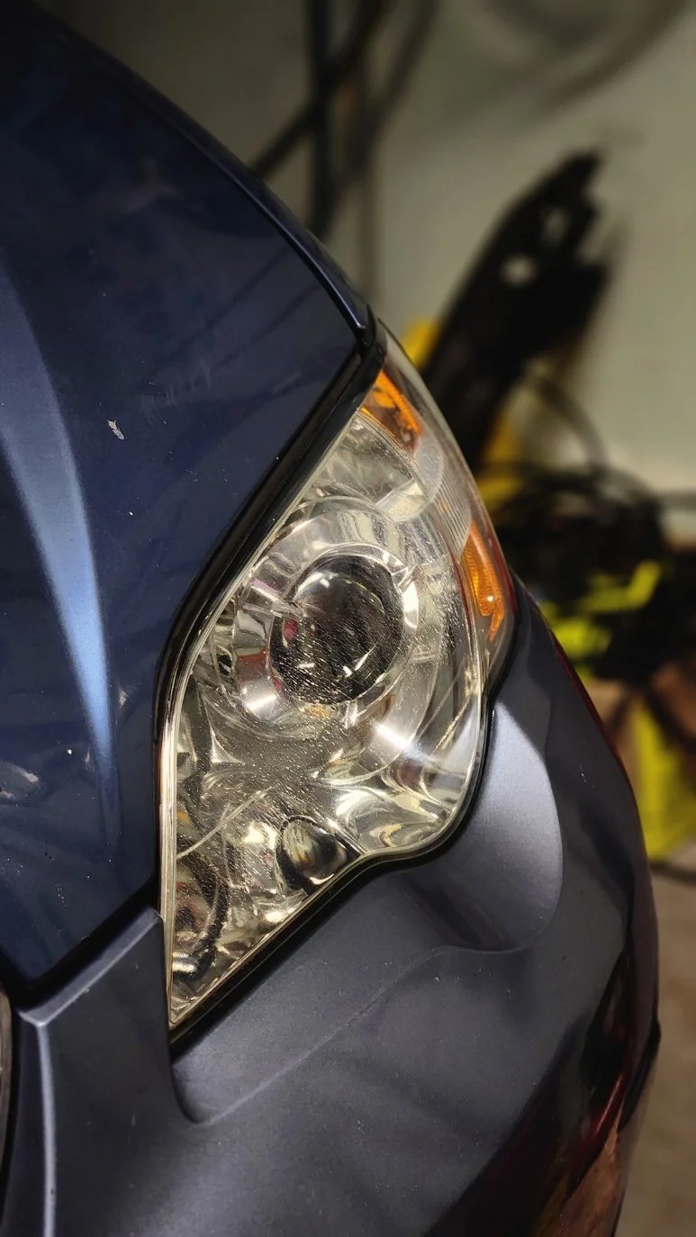 Close-up of a clear Subaru headlight lens after restoration