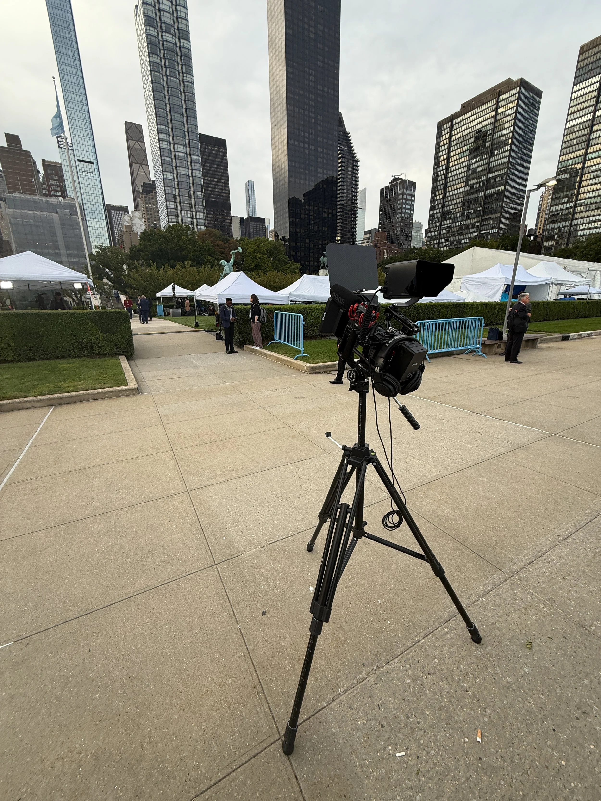 A professional video camera mounted on a tripod filming at the United Nations General Assembly. 